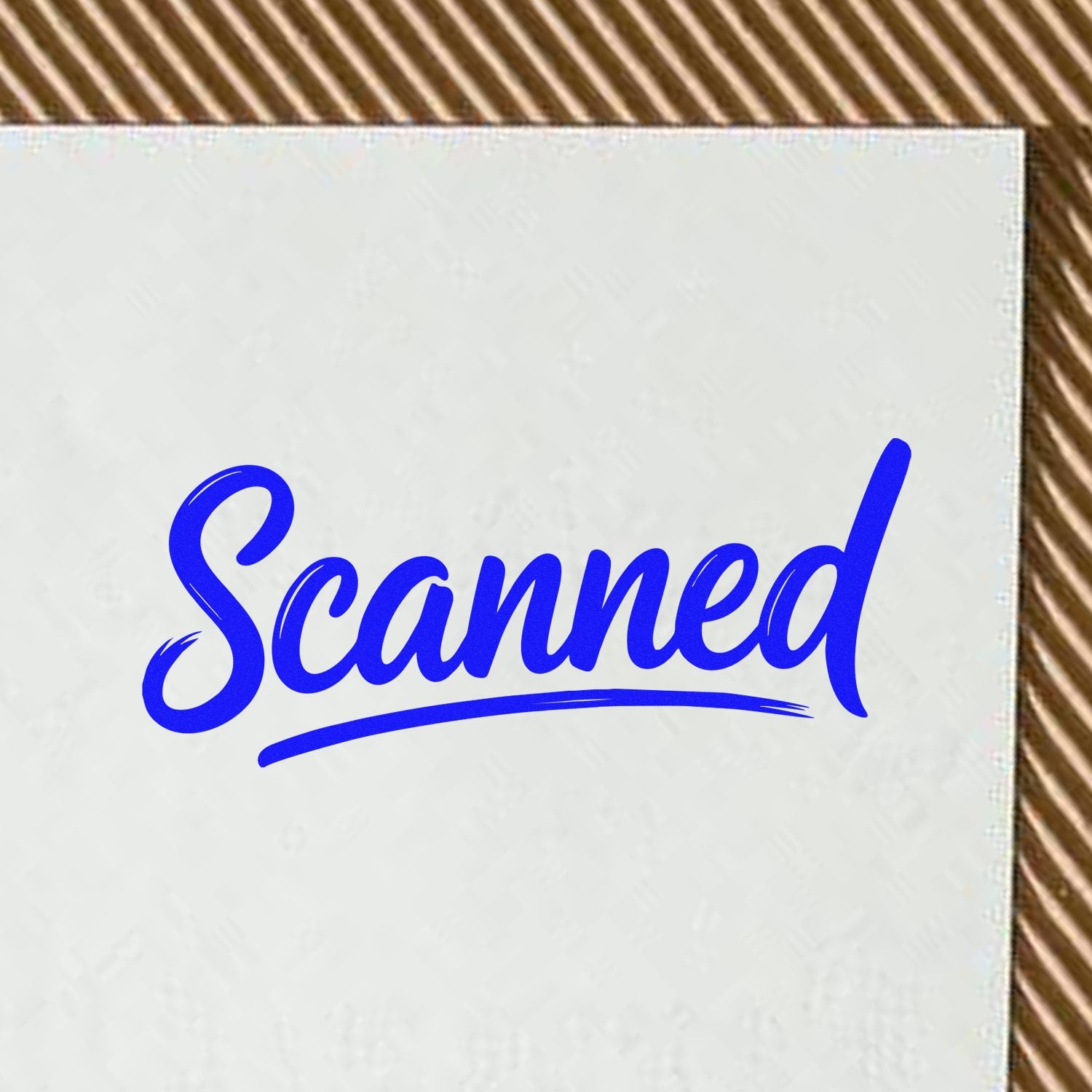 Blue Scanned stamp seal on white textured card with curved underline, on a brown striped surface.