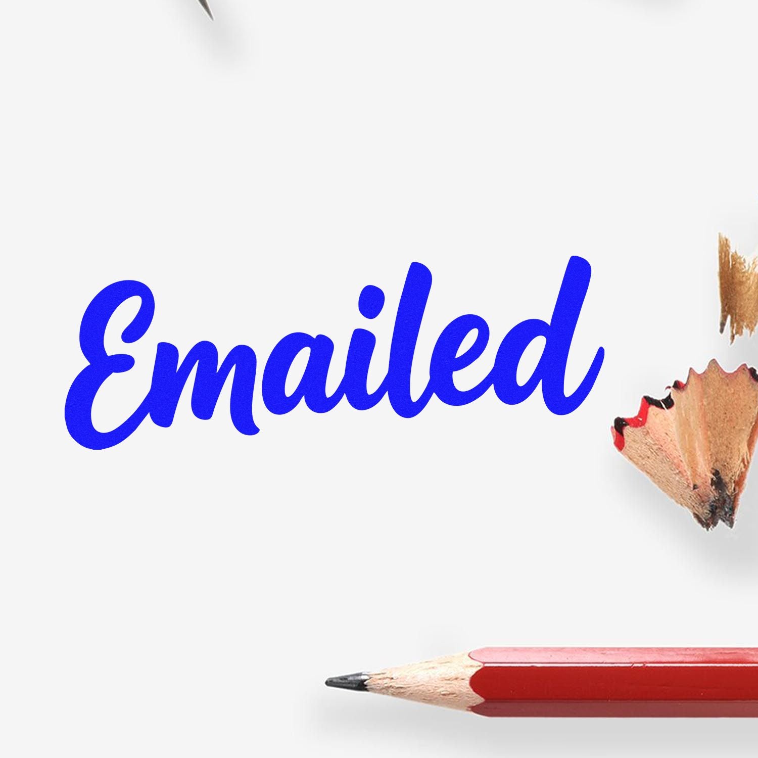 Blue "Emailed" stamp and seal product with pencil shavings on white background.