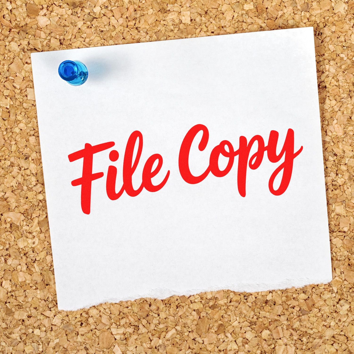 Red File Copy rubber stamp text on white paper, pinned with a blue pushpin over a corkboard.