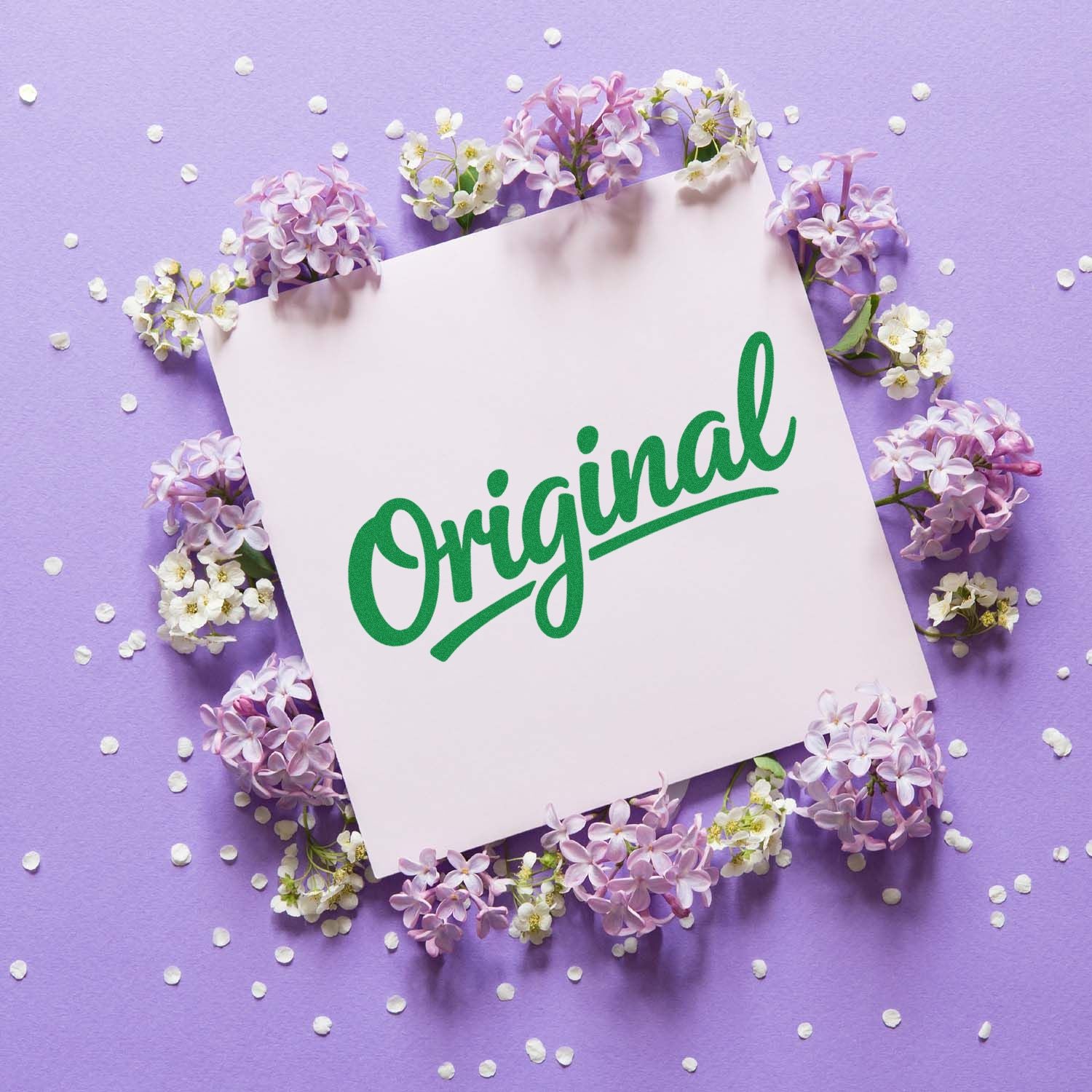 Green Original stamp and seal on pale pink card, framed by lilac and white flowers on a purple background.