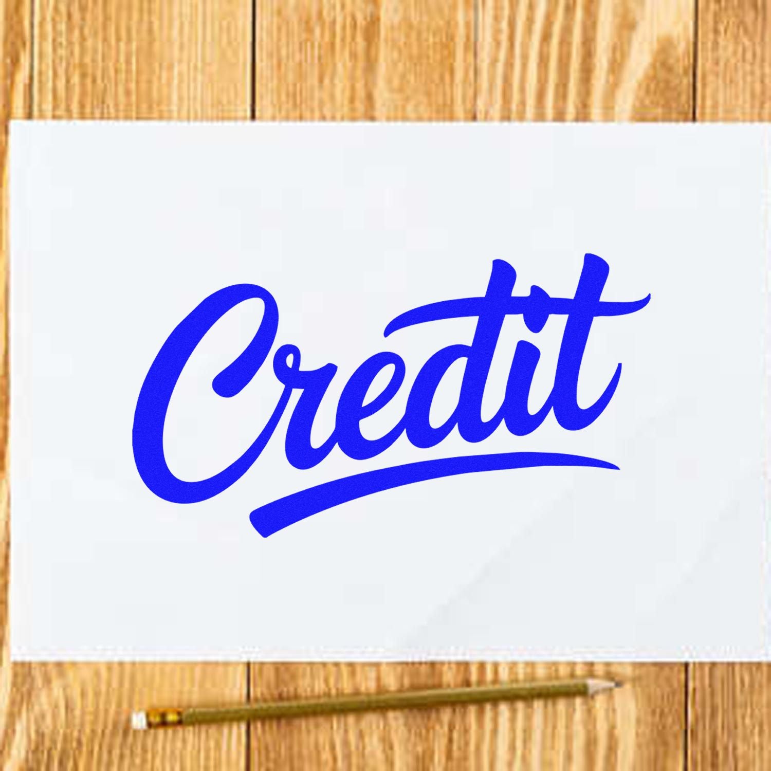 Blue Credit stamp and seal on white paper, with pencil on a wooden desk.