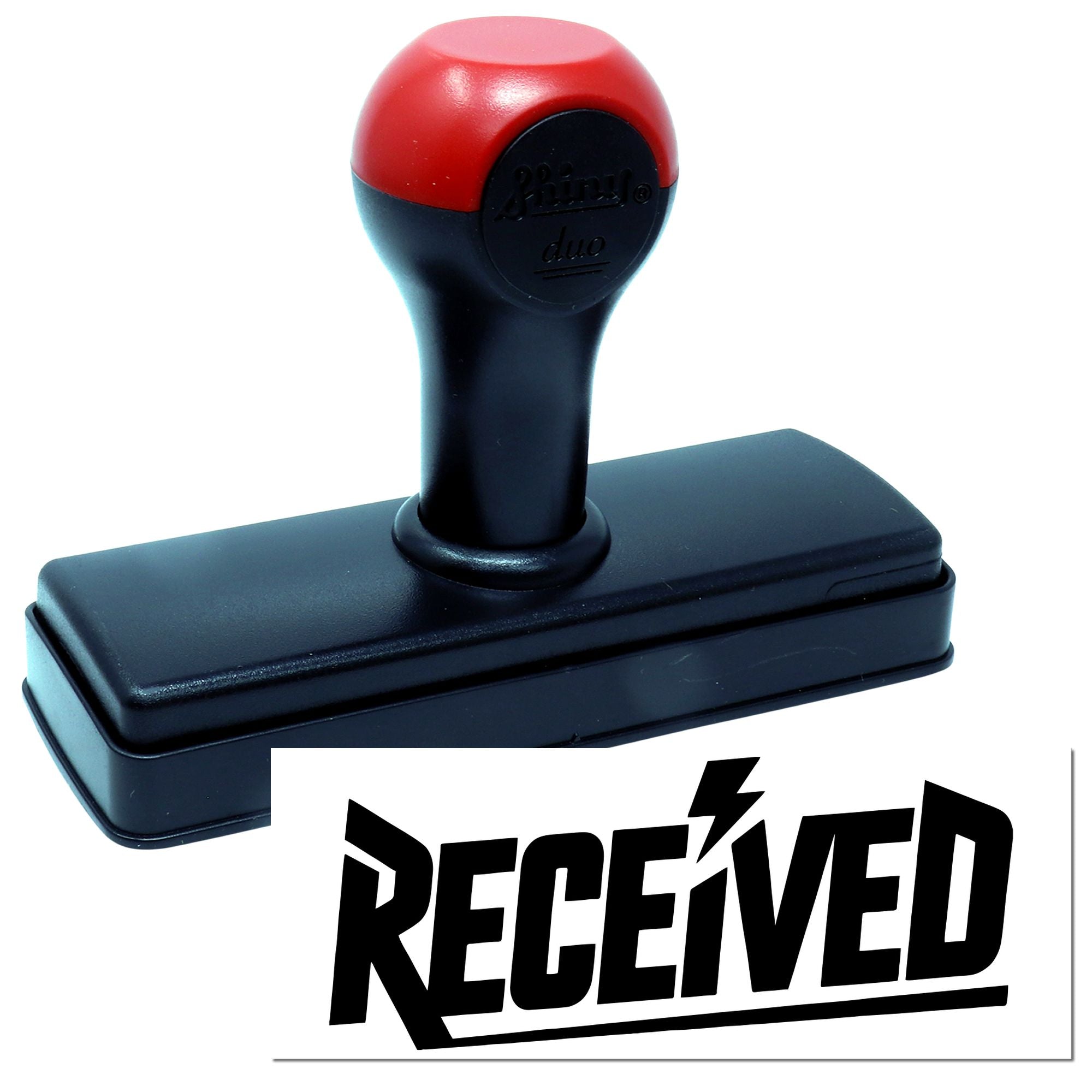 Red and black self-inking stamp with rectangular base, showing bold black RECEIVED seal.