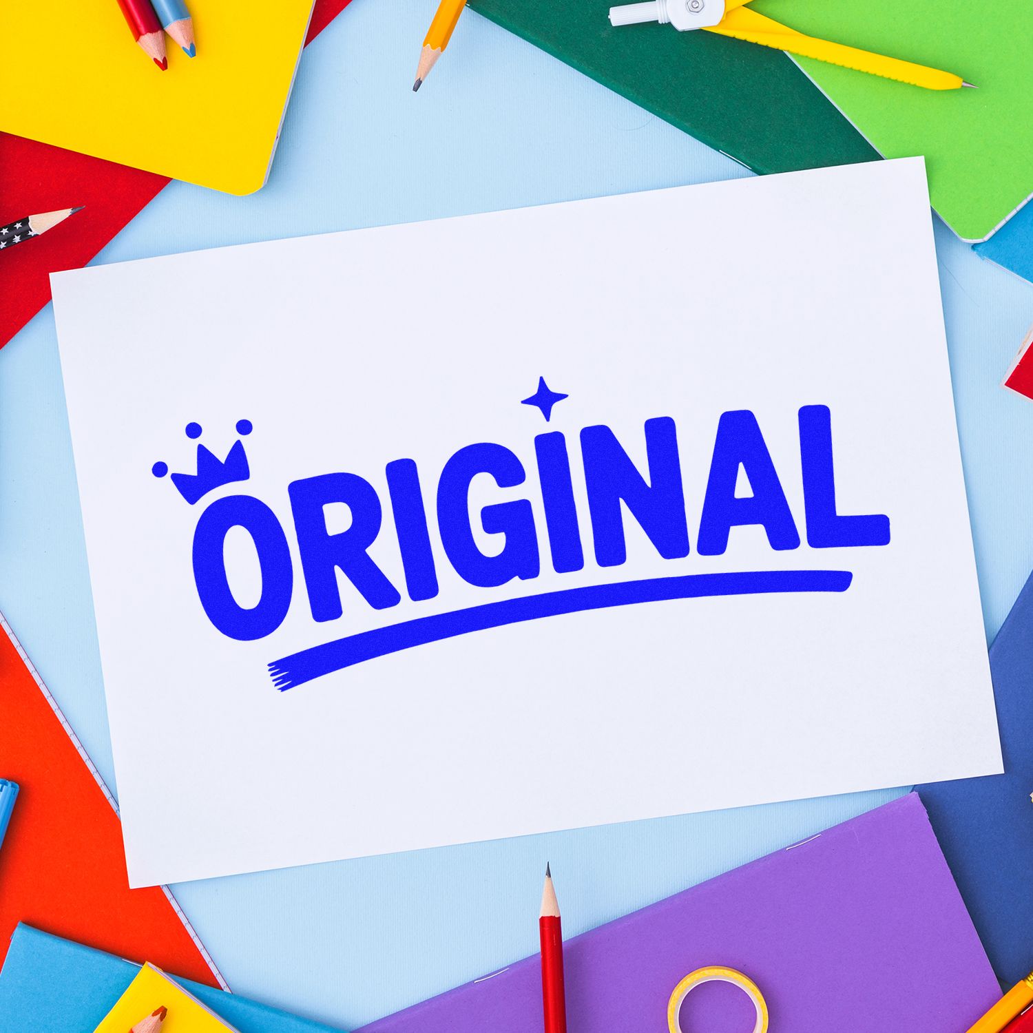 White sheet with blue ORIGINAL rubber stamp seal, surrounded by colorful notebooks and pencils on a light blue background.