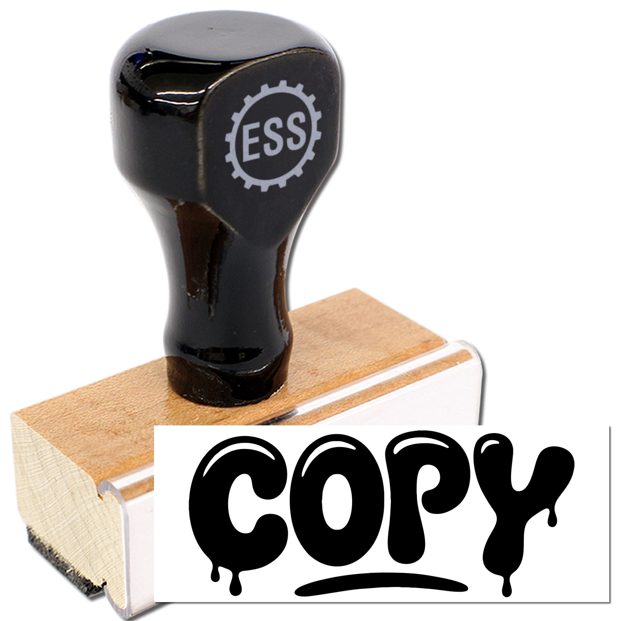 Black ESS rubber stamp and seal on wooden block, showing bold dripping COPY imprint