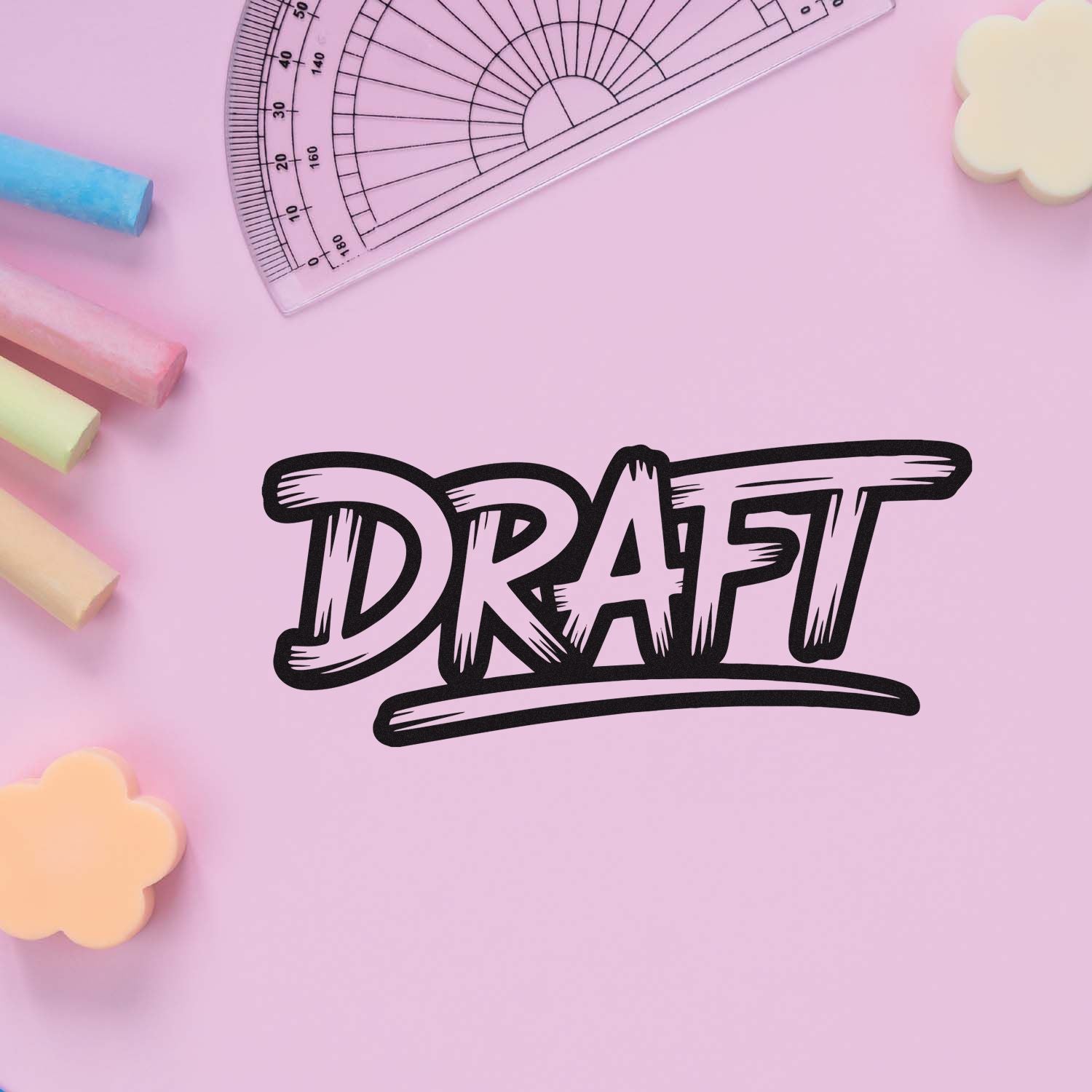 Black DRAFT stamp with transparent protractor on pastel pink background, surrounded by colorful seal-shaped chalk pieces.
