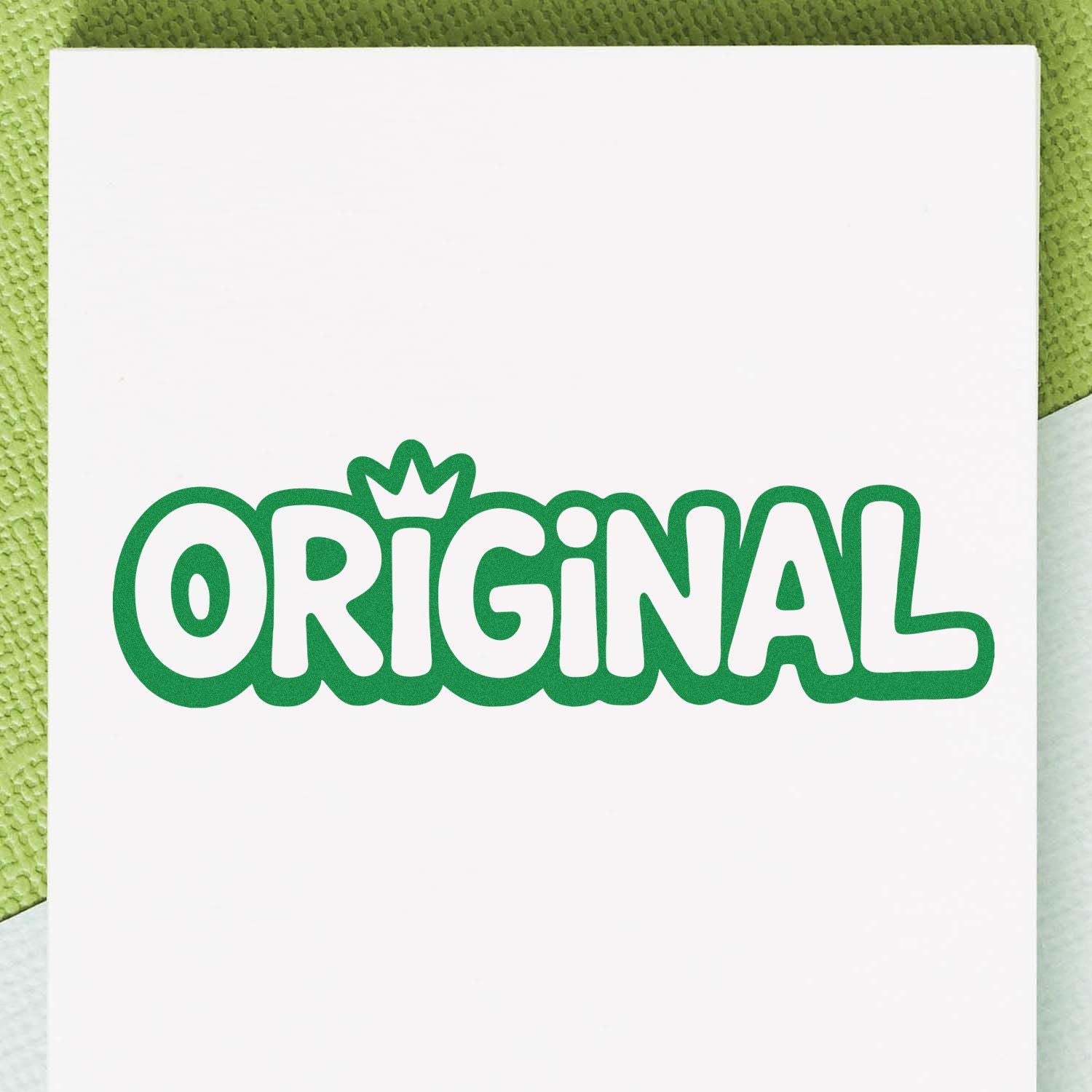 Green ORIGINAL stamp seal with crown detail on white paper, bold rounded lettering for branding.