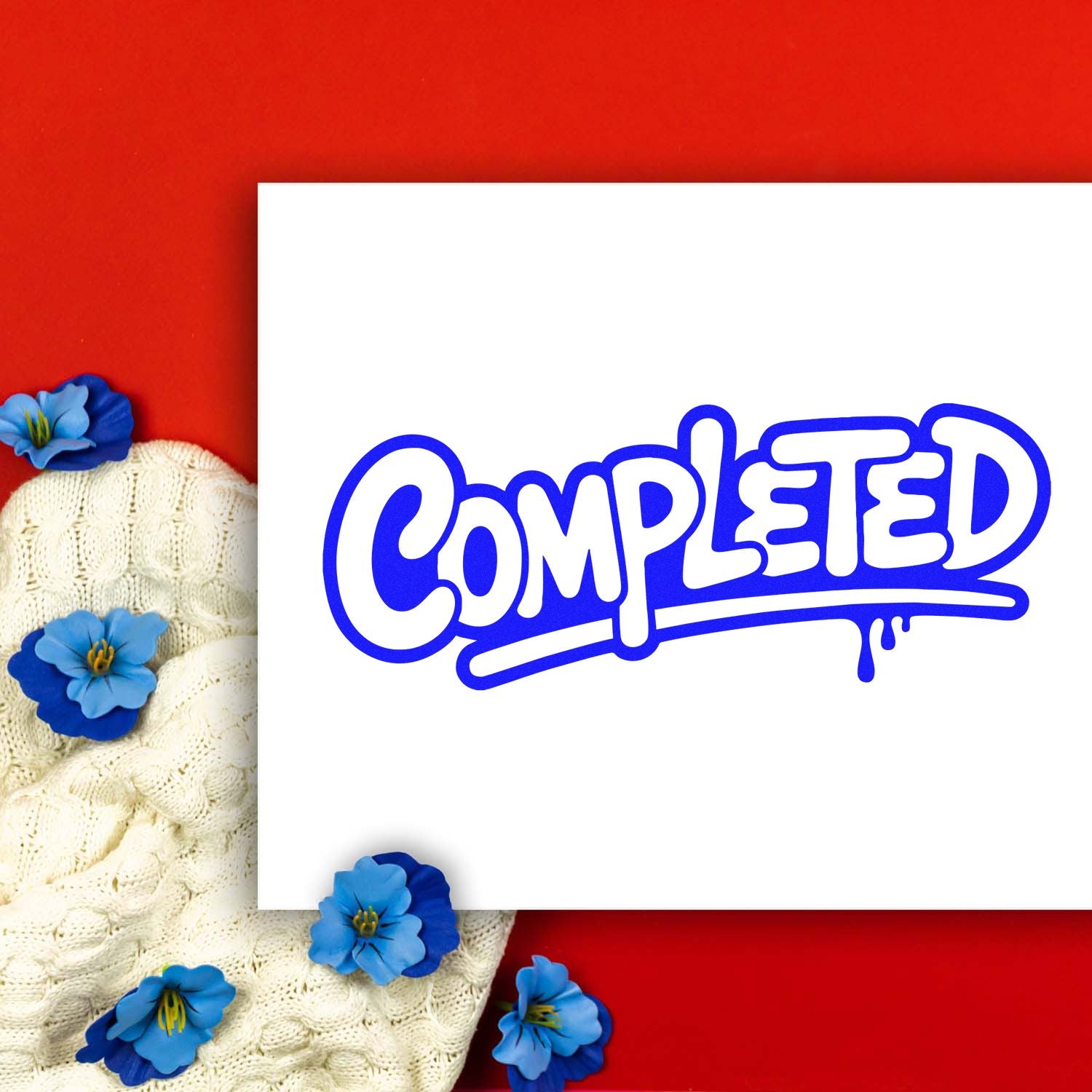 Blue-and-white completed stamp and seal product design on red background with knit fabric and blue flowers.
