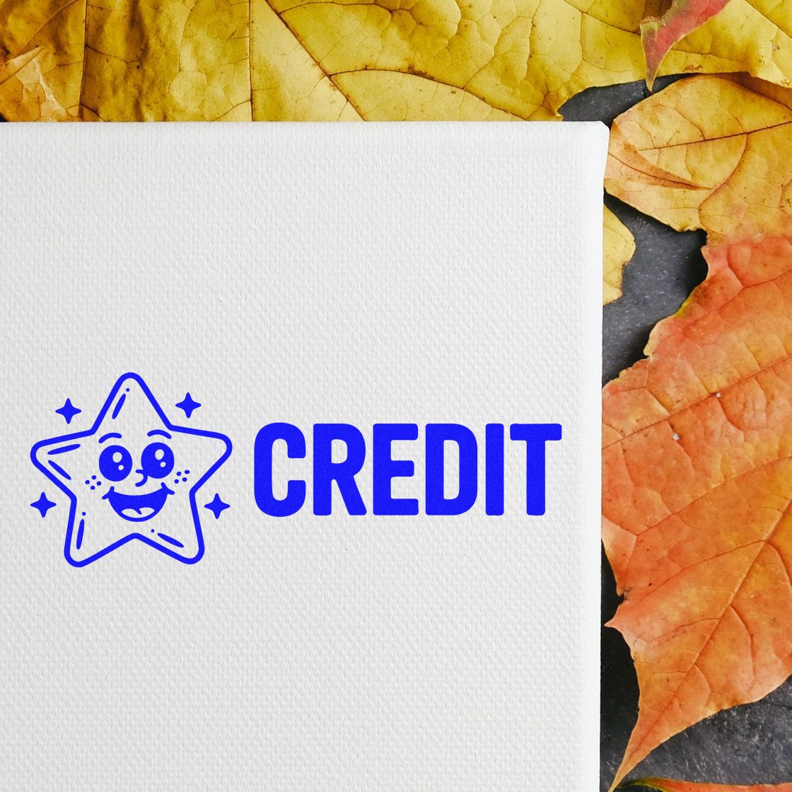 Blue CREDIT stamp and smiling star seal on white textured card, framed by yellow and orange autumn leaves.
