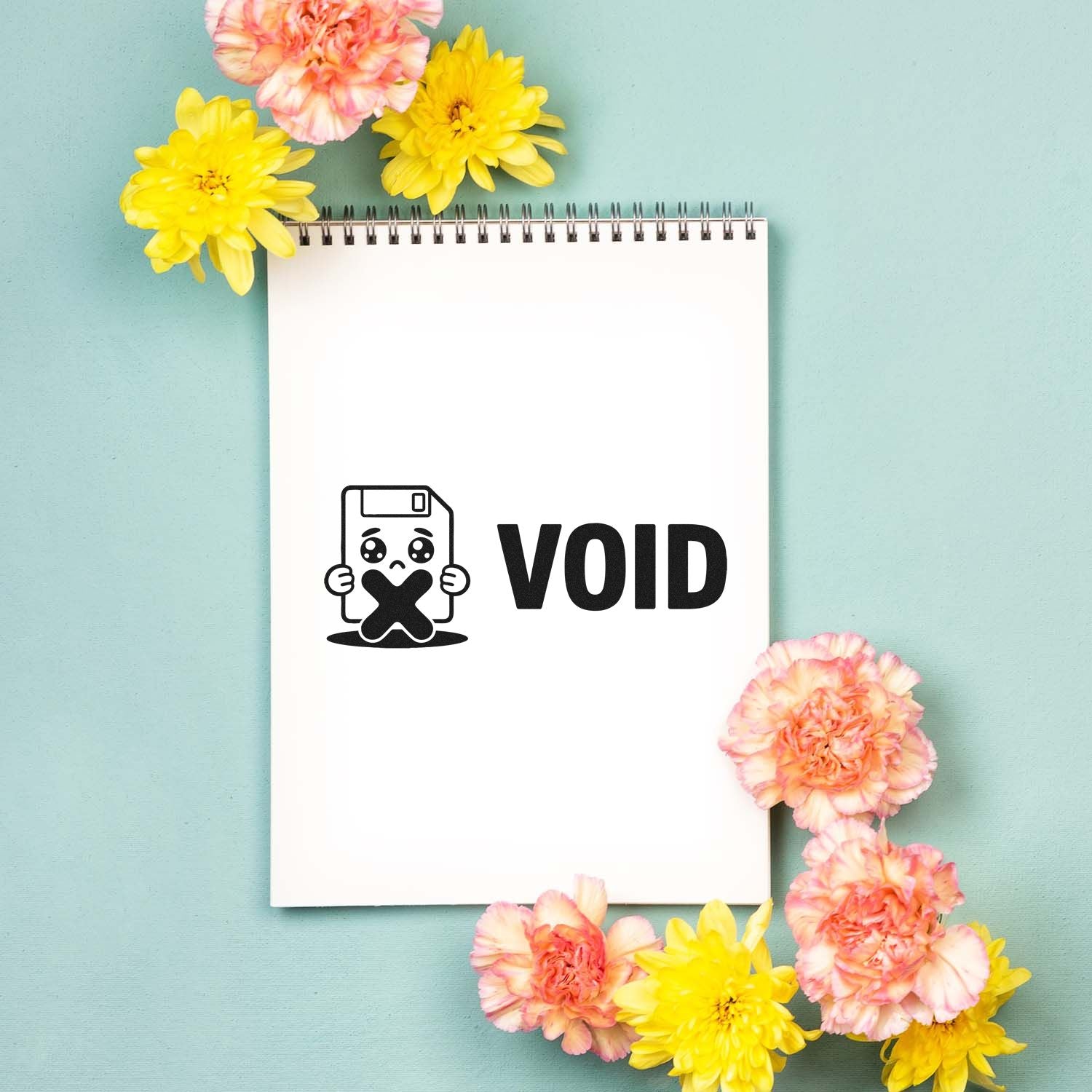 VOID stamp and seal design on a white spiral notebook, with pink and yellow flowers on a mint background.