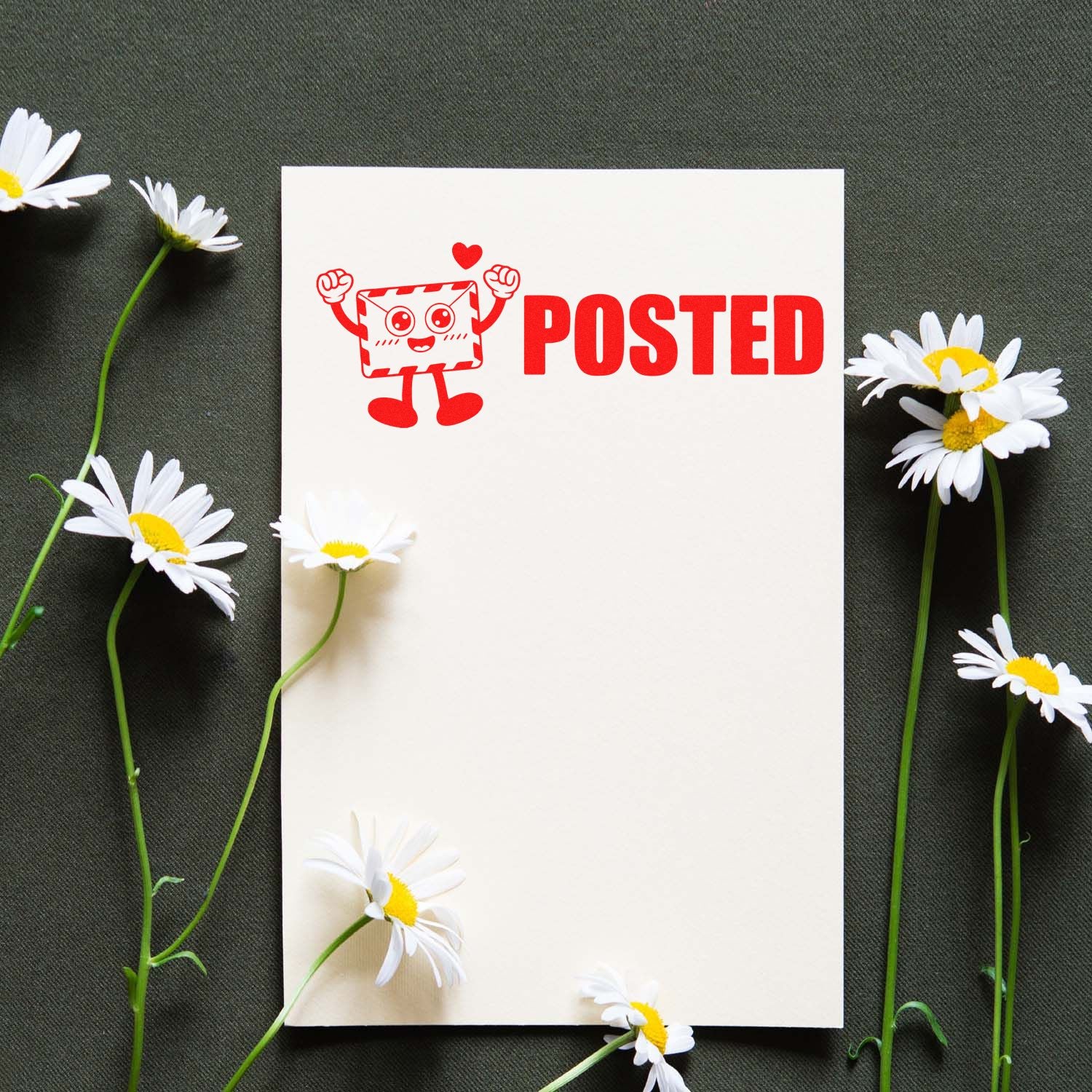 White card with red POSTED stamp seal, smiling envelope mascot, and daisies on a dark green fabric background.