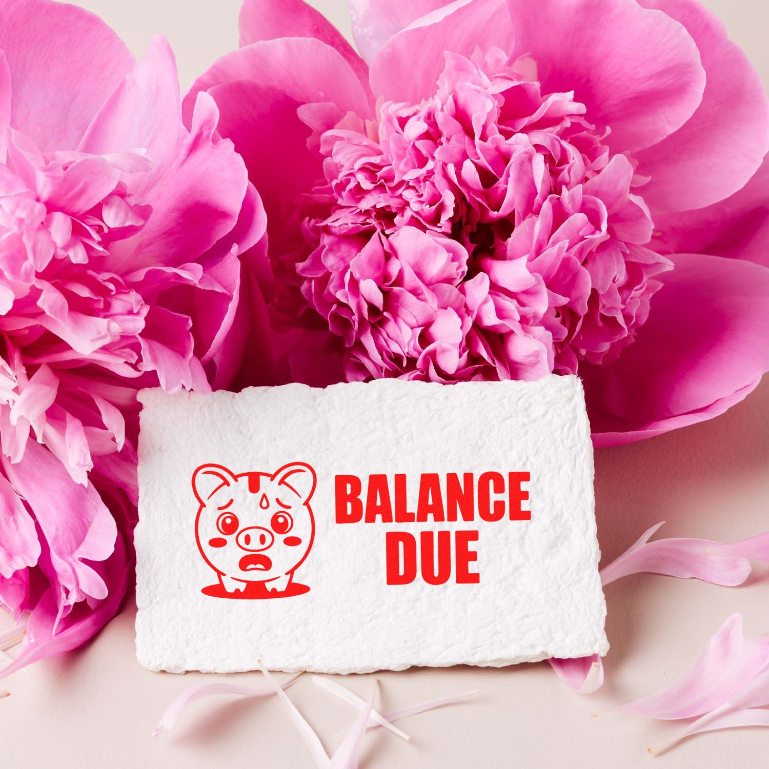 White textured paper with red Balance Due pig stamp seal, surrounded by bright pink peony petals.