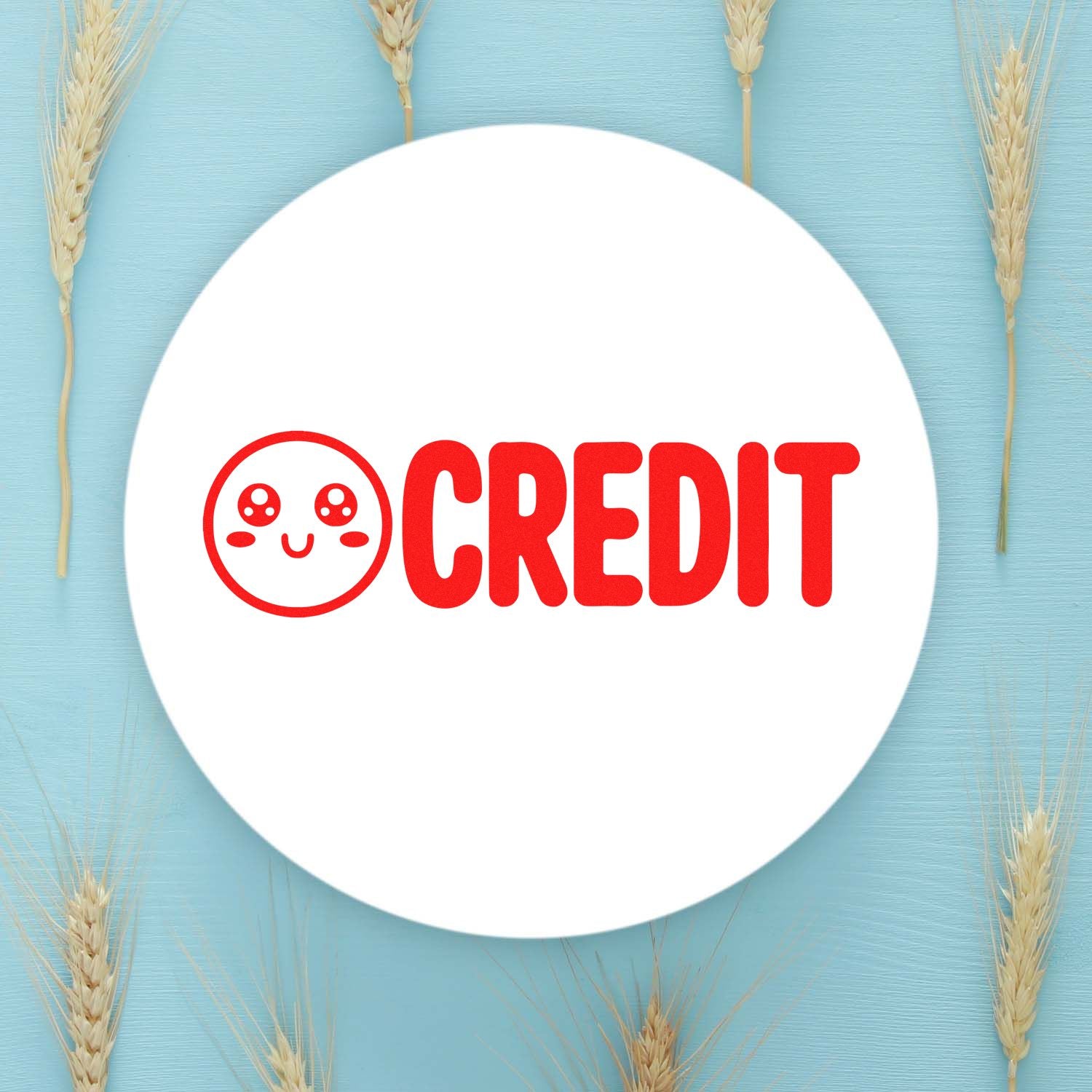 White round stamp seal with red CREDIT logo and smiley face on light blue background with wheat stalks.