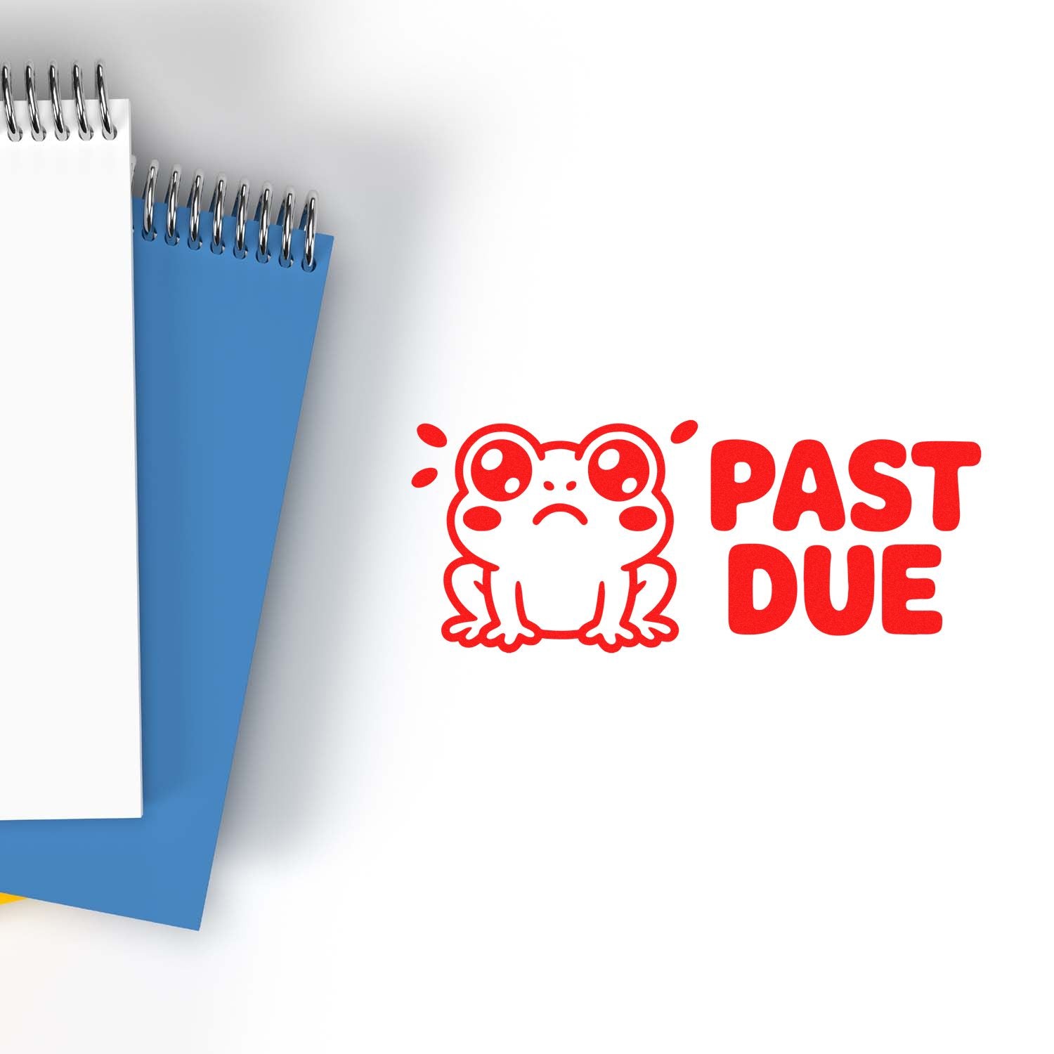 Red sad frog PAST DUE stamp and seal beside blue and white spiral notepads on a white background.