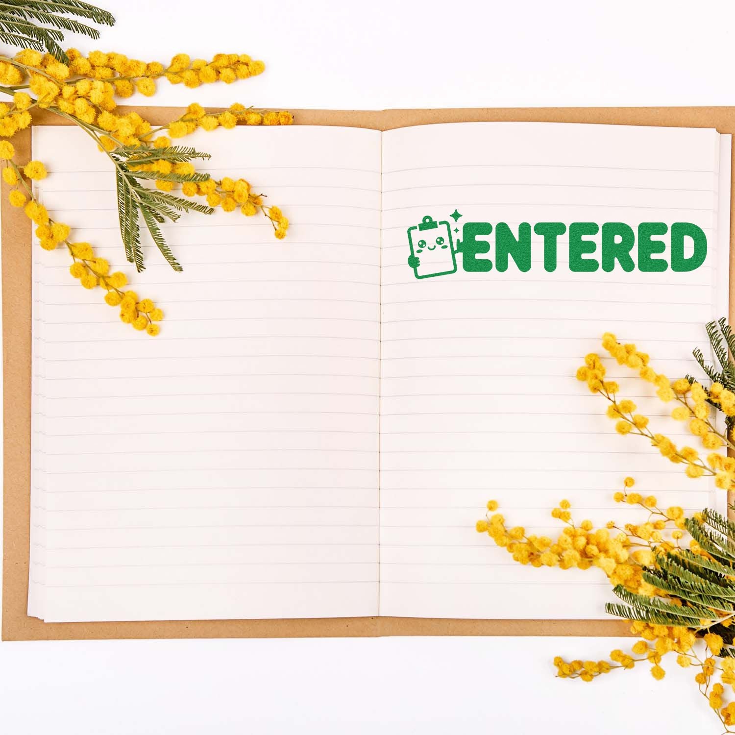 Green ENTERED stamp with clipboard icon on open lined notebook, framed by bright yellow mimosa flowers.