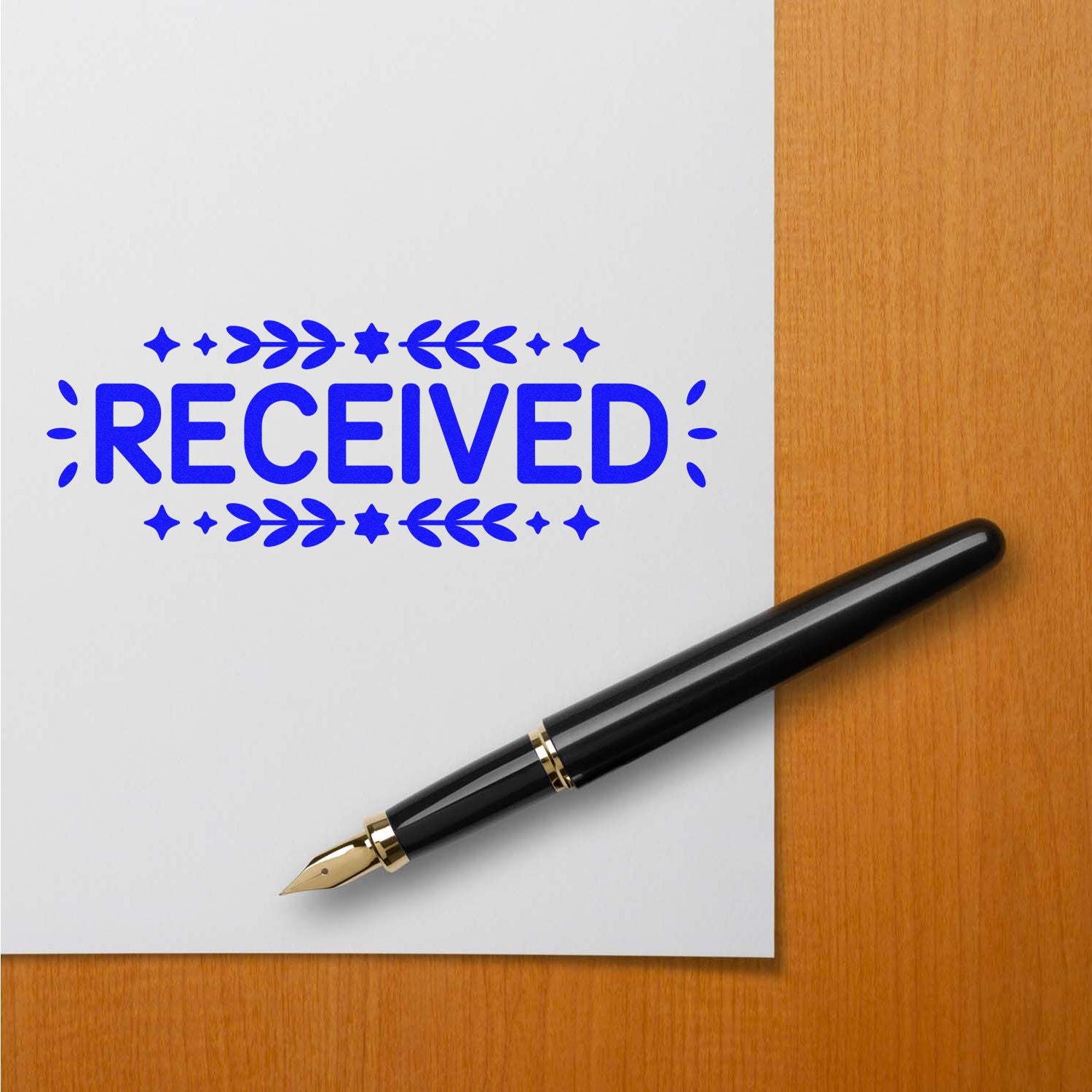 Blue RECEIVED stamp and seal impression on white paper beside a black fountain pen on a wooden desk.