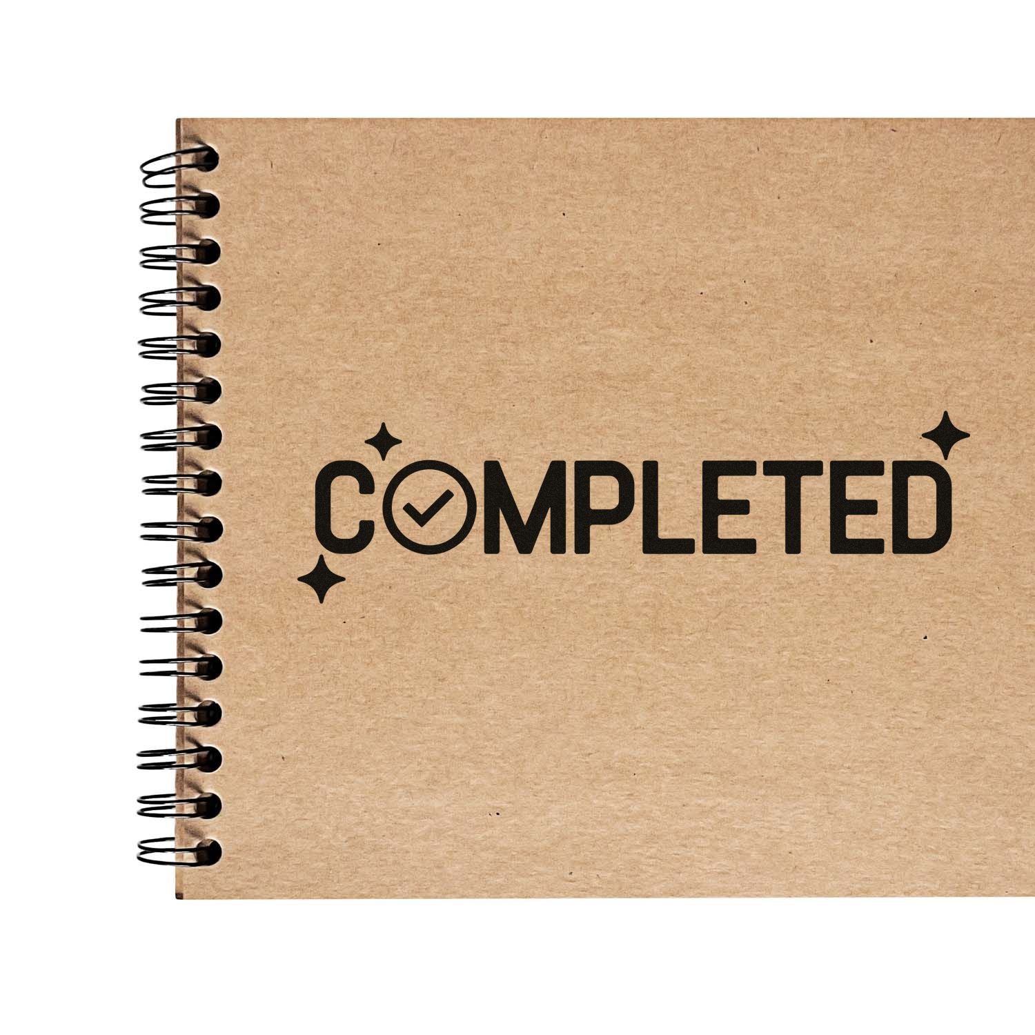 Kraft spiral notebook with black COMPLETED stamp seal and checkmark, accented by sparkle icons.