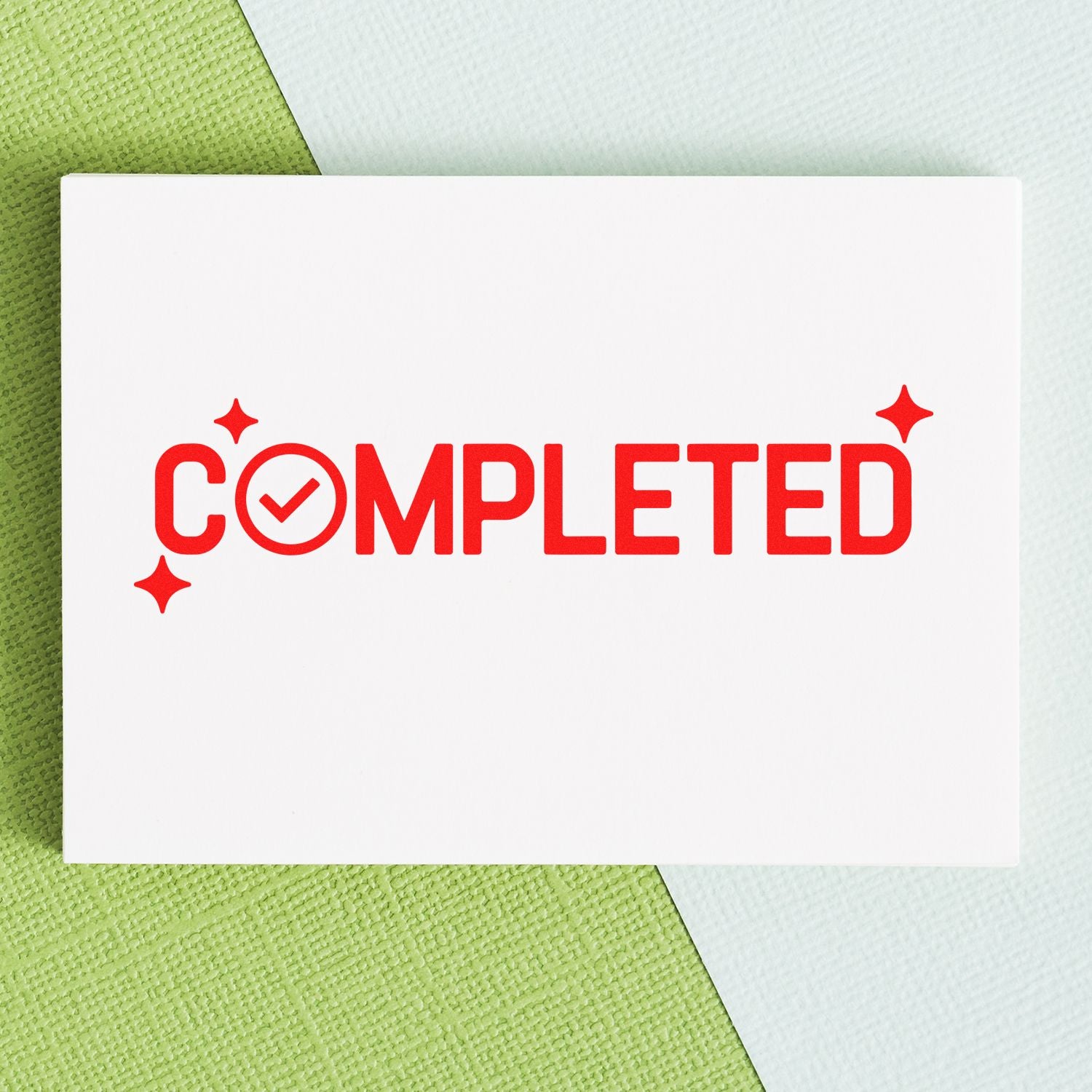 Red COMPLETED rubber stamp with checkmark on white card over green and white textured background.