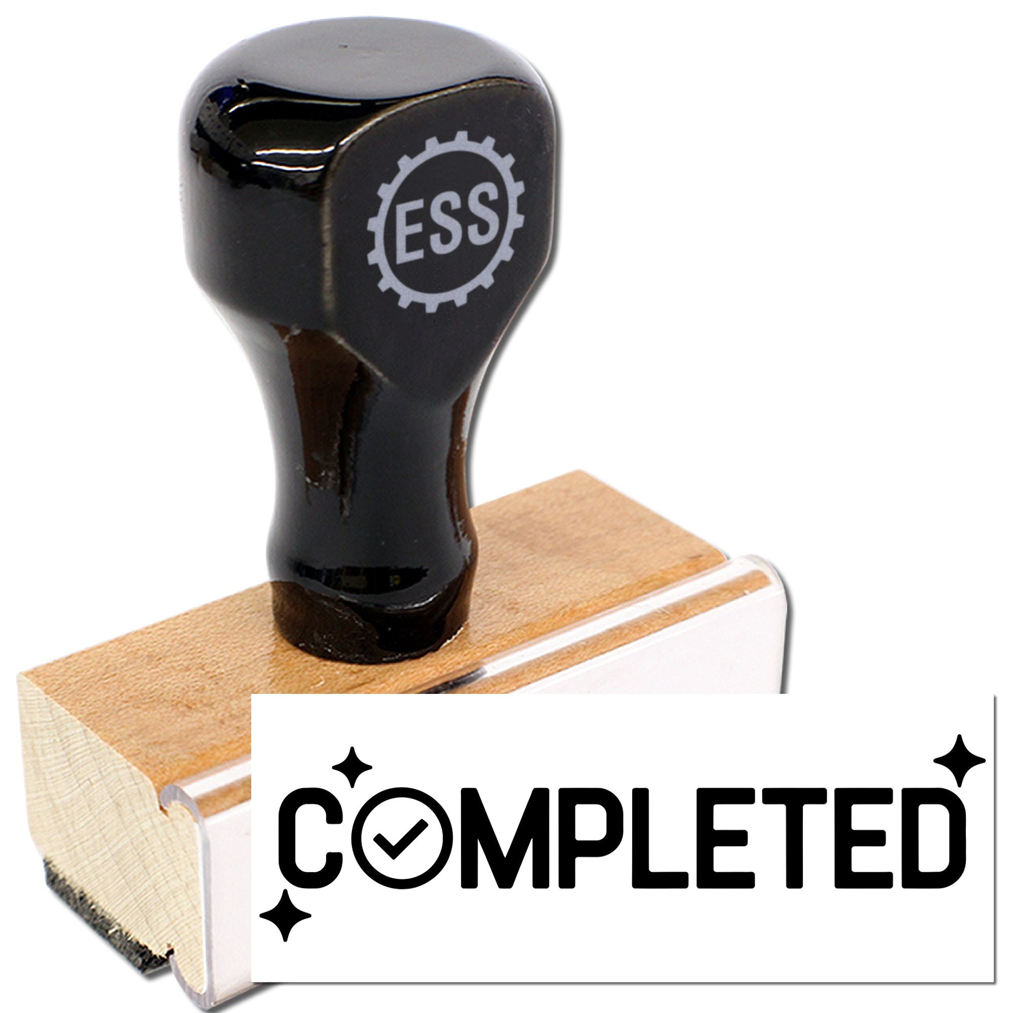Black rubber stamp seal with ESS gear logo on a wooden block, marking a white card with COMPLETED.