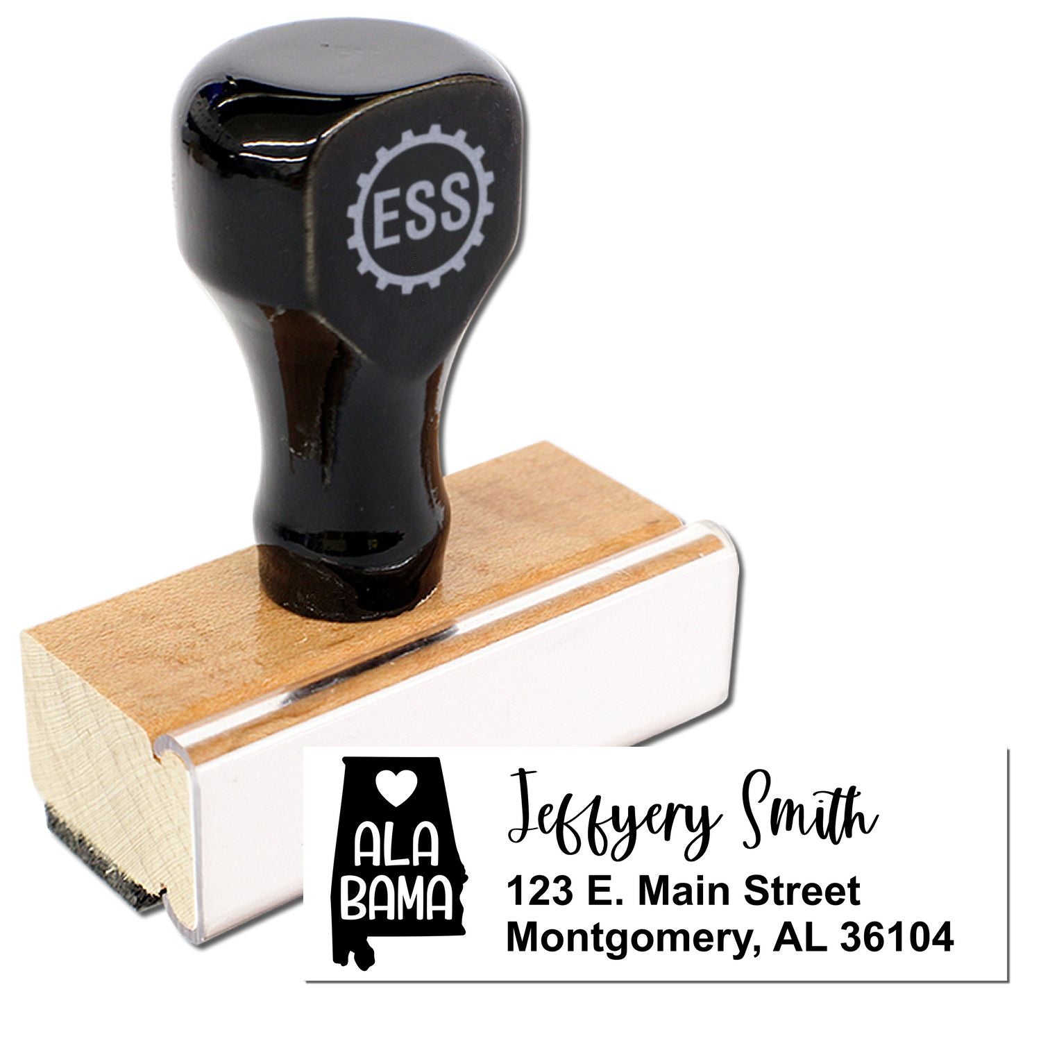 Alabama State Love Personalized Address Stamp with a wooden handle and black top. Features a heart design and customizable address text, shown with Jeffery Smith, 123 E. Main Street, Montgomery, AL 36104.