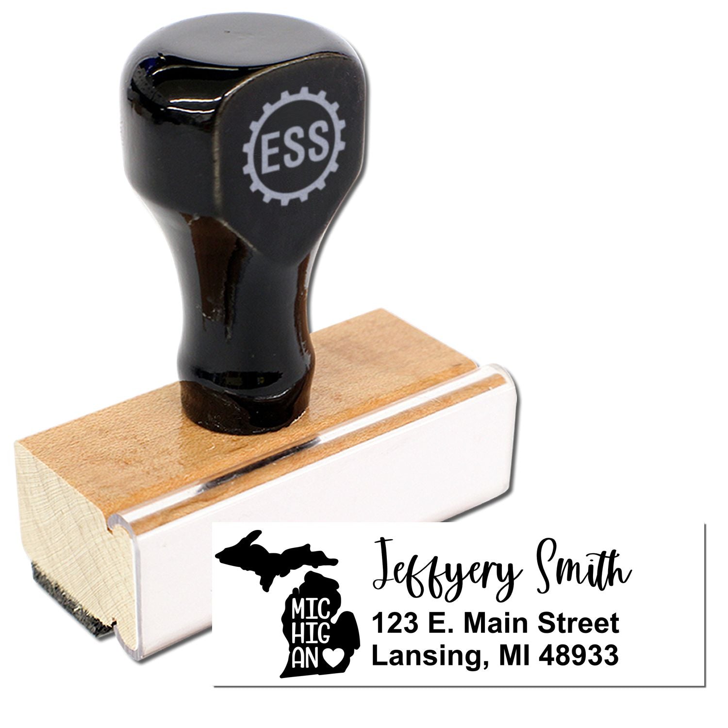 Image of the Michigan State Love Personalized Address Stamp with a wooden handle and black top, featuring a sample address with a Michigan state outline and heart design.