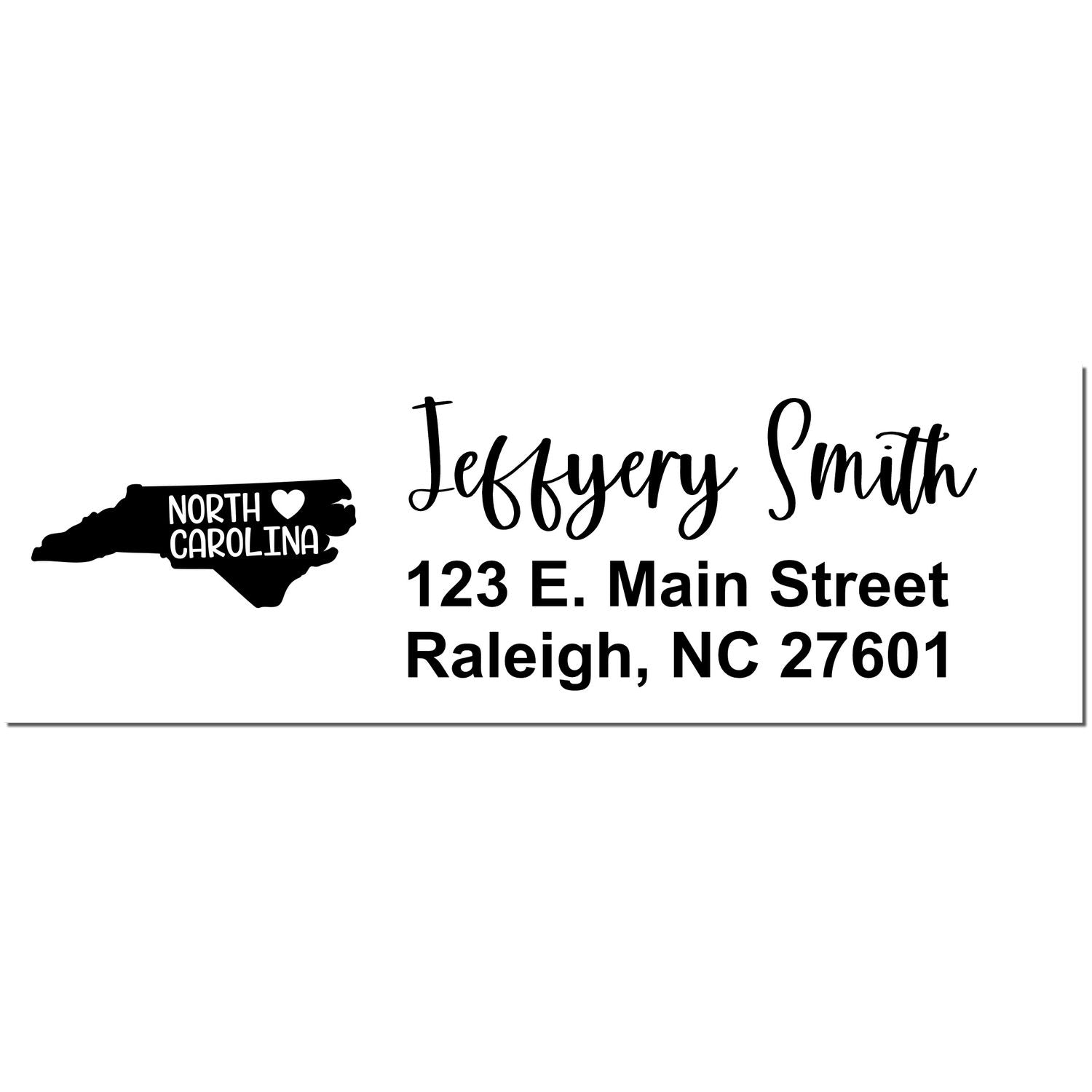 State Love of North Carolina Custom Address Stamp Self-Inking featuring a black silhouette of North Carolina with a heart, personalized with Jeffery Smith, 123 E. Main Street, Raleigh, NC 27601 .