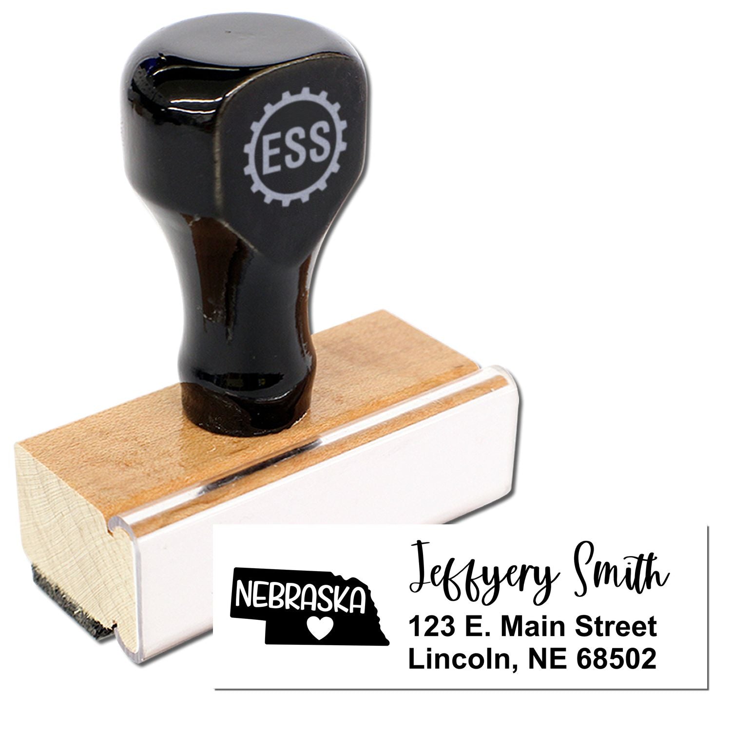 Image of the Nebraska State Love Personalized Address Stamp with a wooden base and black handle. The stamp imprint shows a Nebraska state outline with a heart, personalized with a name and address.