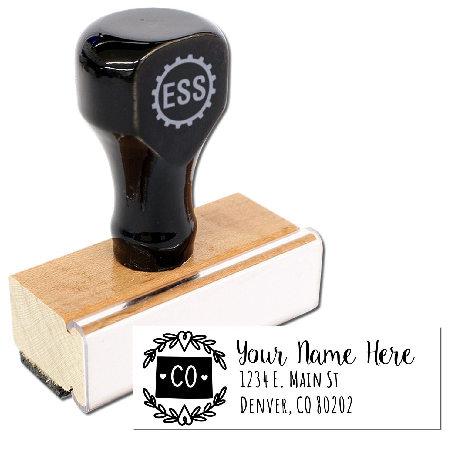 Colorado State Custom Return Address Stamp with a wooden base and black handle. Features a decorative CO design and sample address text: Your Name Here, 1234 E. Main St, Denver, CO 80202.