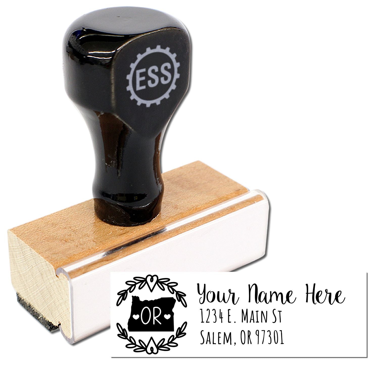 Black wooden Oregon State Custom Return Address Stamp with ESS logo, featuring a floral border design. Personalize with your name and address. Ideal for adding a personal touch to mail.