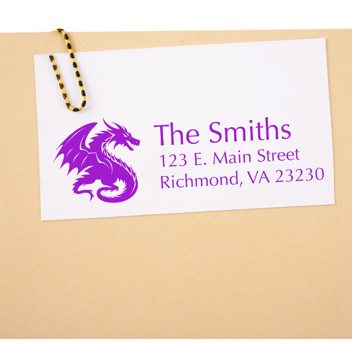 Custom purple address stamp and seal for The Smiths with dragon logo, clipped to tan card stock.