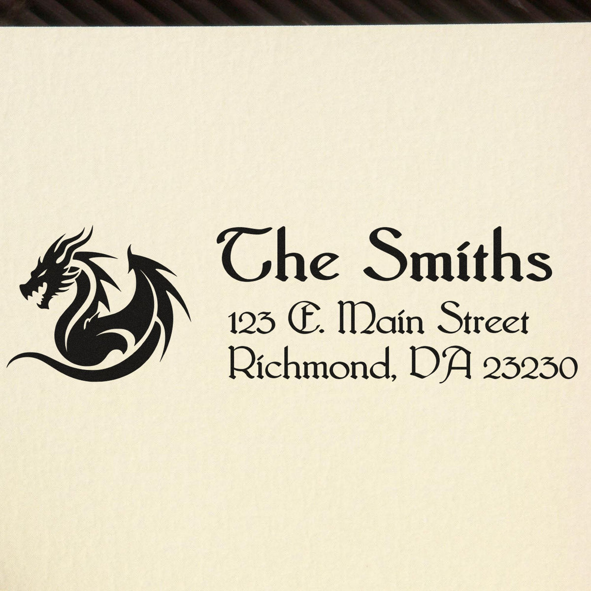 Black custom address stamp and seal with dragon logo on cream paper: The Smiths, 123 E. Main Street, Richmond, DA 23230