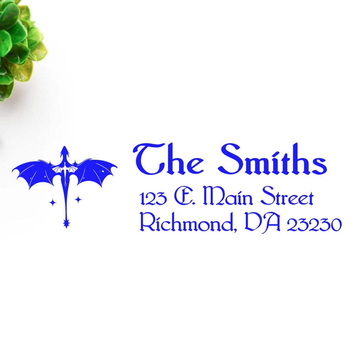 Blue custom address stamp and seal with bat logo, reading The Smiths, 123 E. Main Street, Richmond, VA 23230 on white.