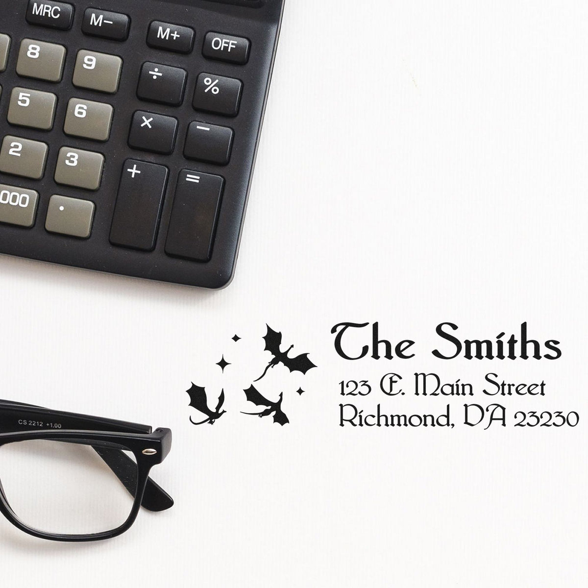Black custom address stamp and seal for The Smiths, with bats, calculator, and eyeglasses on a white background.