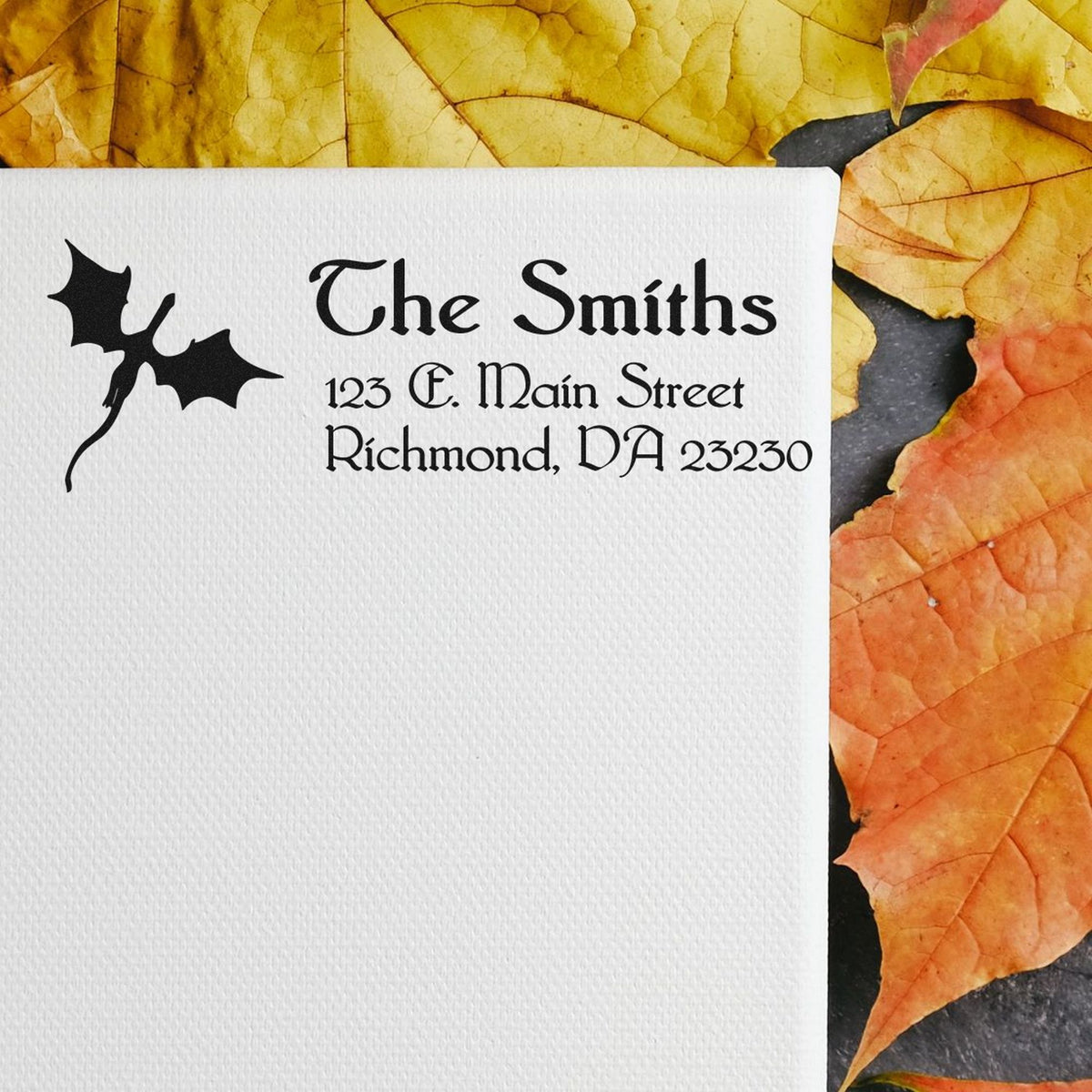 Custom stamp and seal for The Smiths, black on white textured card, with yellow-orange autumn leaves.