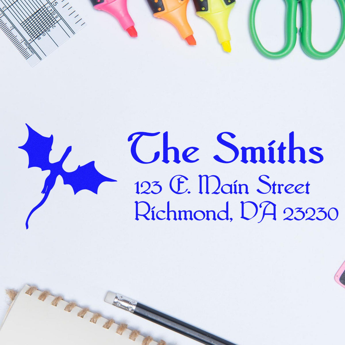 Blue custom stamp and seal with leaf logo, surrounded by pink, orange, yellow and green markers.