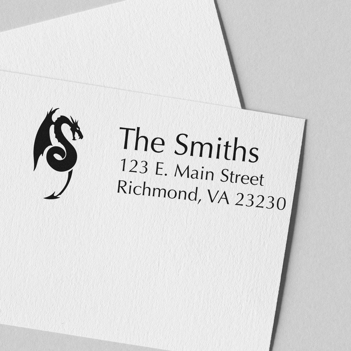 Black dragon stamp and seal on white textured stationery with The Smiths and Richmond, VA address.