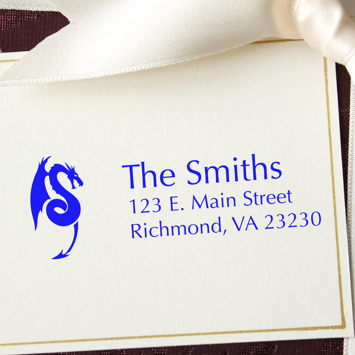 Blue custom stamp and seal card for The Smiths, with dragon logo, gold border, and Richmond, VA address on white paper.