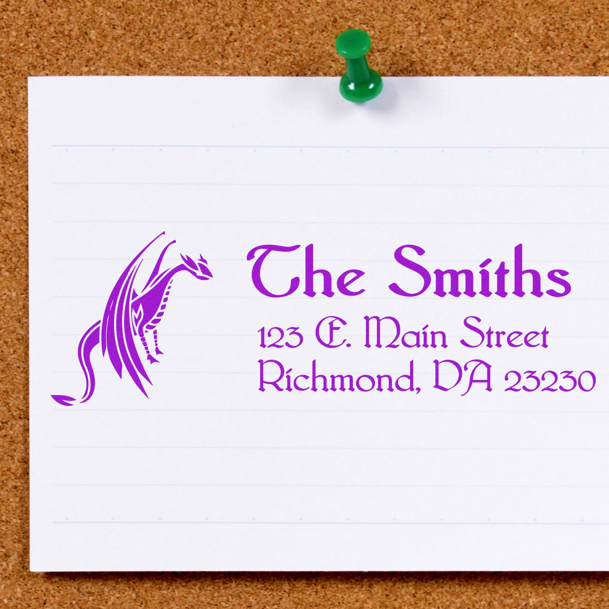 Purple custom stamp and seal for The Smiths with dragon logo and address, pinned on white paper with green pushpin.