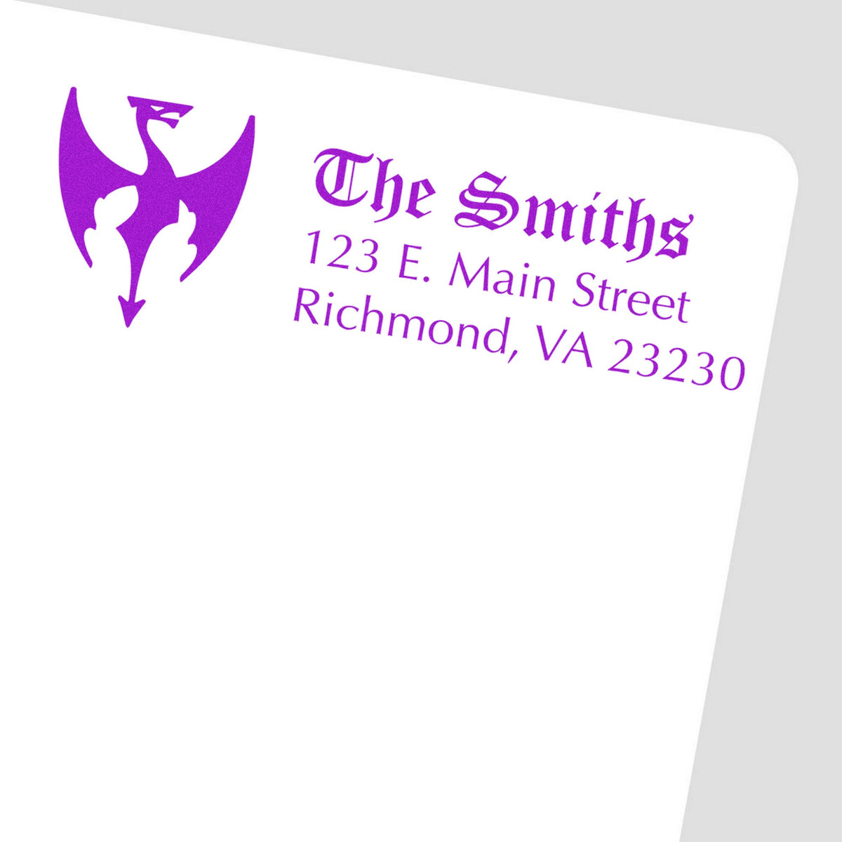 Purple custom stamp and seal for The Smiths with logo and address on a white card background.