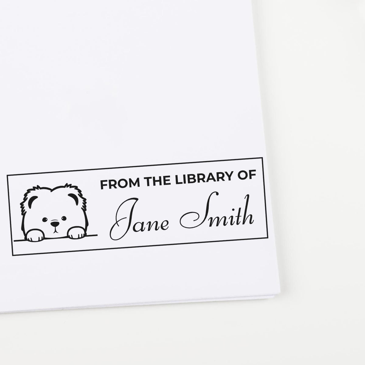 Black-and-white custom library stamp seal with bear illustration and From the Library of Jane Smith