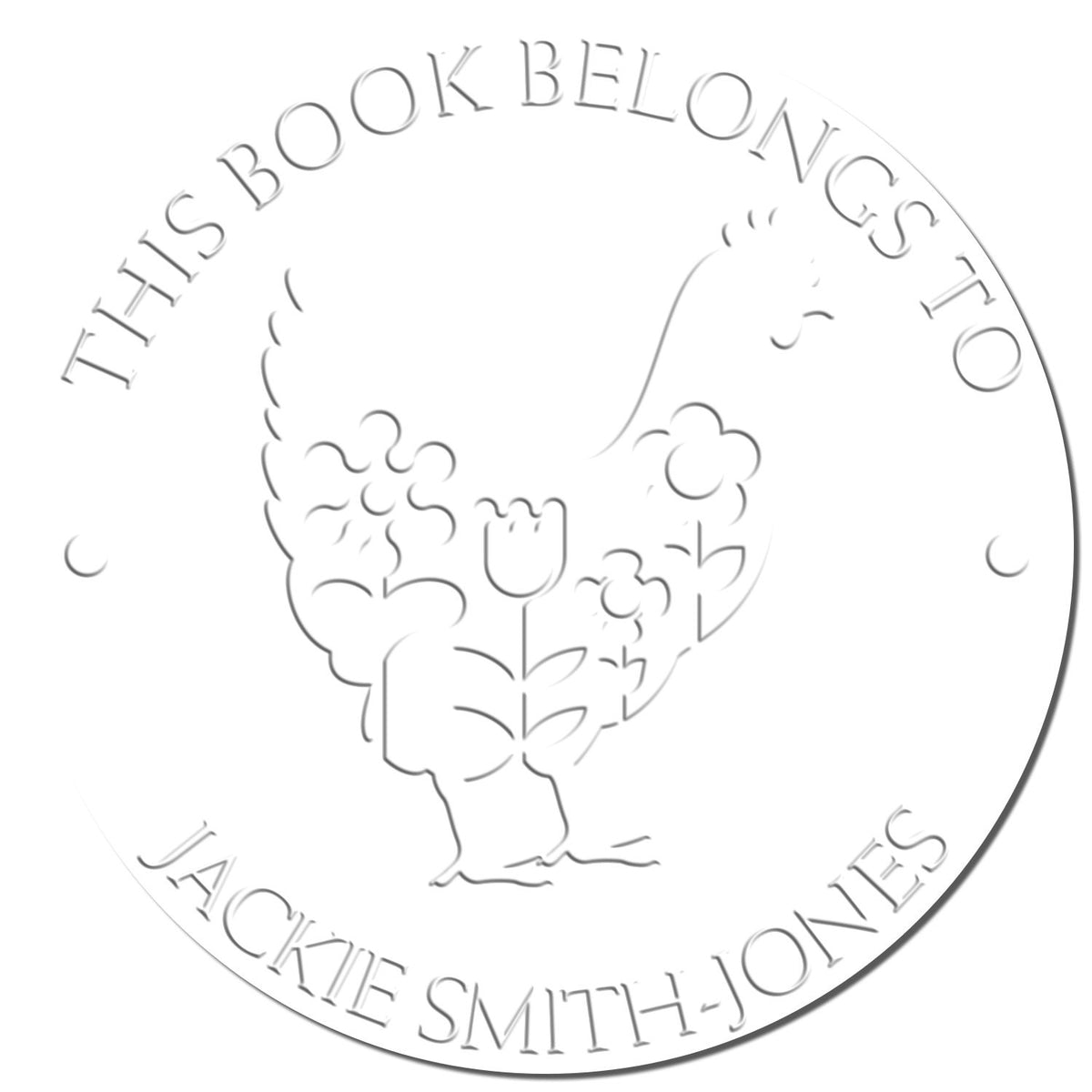White circular embossing seal with light gray floral design and text This Book Belongs to Jackie Smith-Jones.