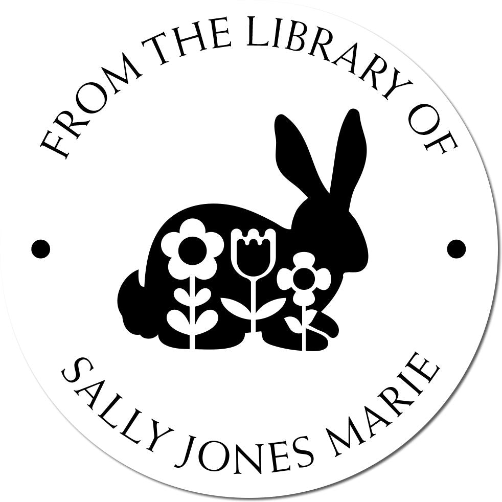 Black-and-white circular library stamp seal with rabbit and flowers, reading From the Library of Sally Jones Marie