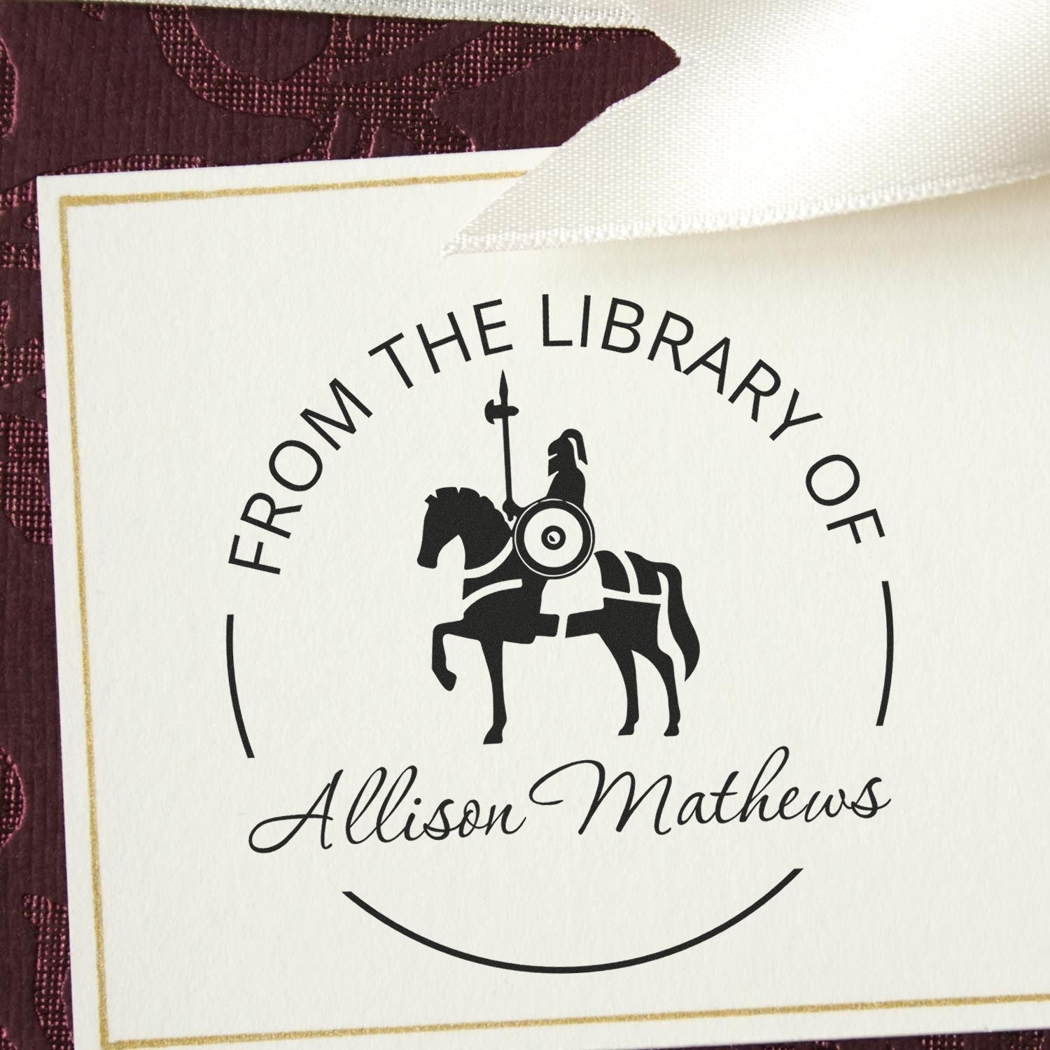 Custom black horse library stamp and seal for Allison Mathews on a white card with gold border and burgundy background.