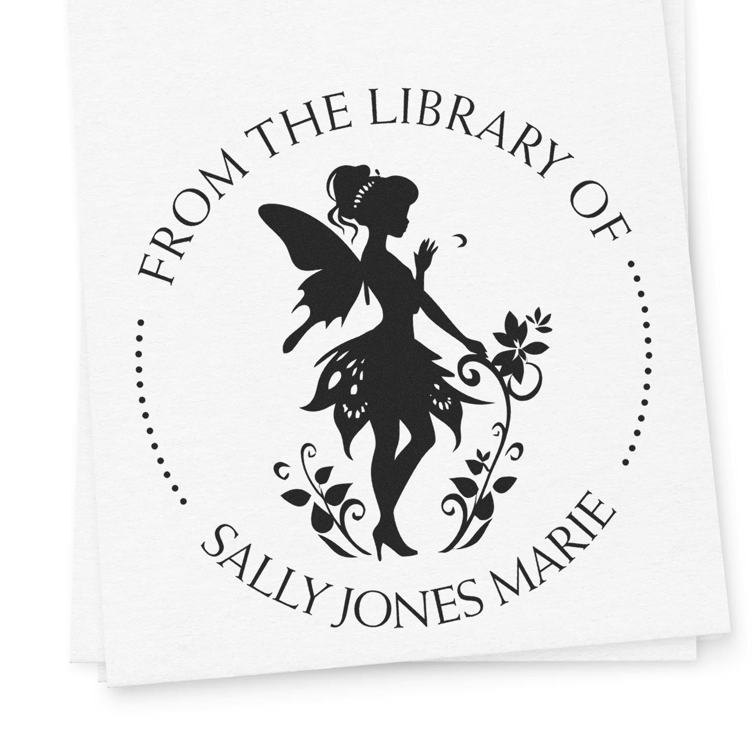 Custom black library stamp seal with fairy silhouette, floral accents, and From the Library of Sally Jones Marie text.