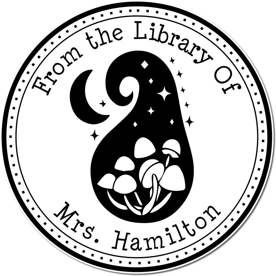 Black and white round library stamp seal with crescent moon, stars, mushrooms, and From the Library Of Mrs. Hamilton text.