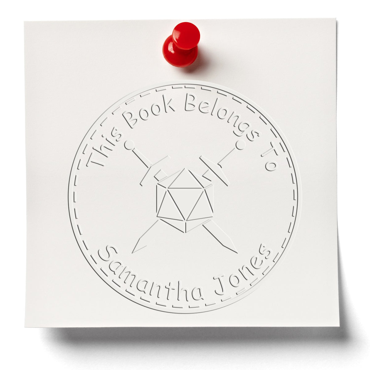 White embossed stamp seal for This Book Belongs to Samantha Jones with red push pin and circular geometric logo.