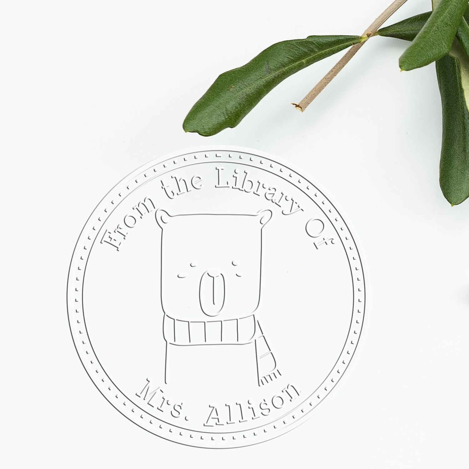 BounceTail Cartoon Animal Handheld Personalized Book Library Name Seal featuring a cute bear with a scarf. The Personalizable Return Mail Stamp reads "From the Library Of Mrs. Allison" and is placed on a white background with a green leaf nearby.