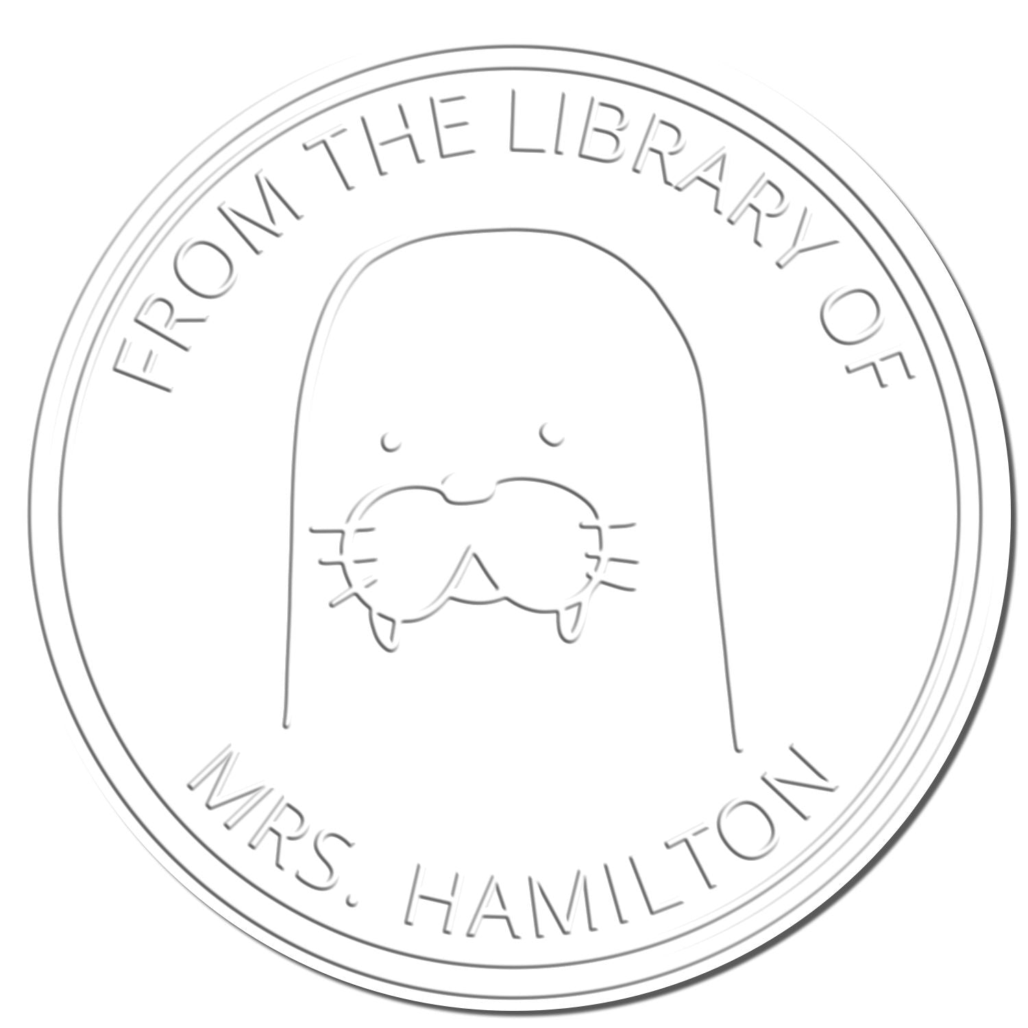 Cartoon animal seal with a mustache, labeled "From the Library of Mrs. Hamilton." Features keywords: BumbleBristle, Cartoon Animal, Handheld, Personalized, Belongs To The Library Of Seal, Customized Home Stamp.