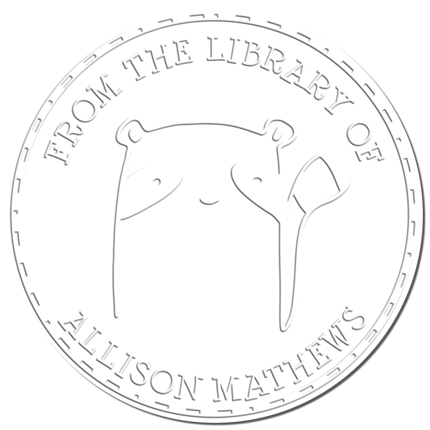 FreckleFlop cartoon animal design on a handheld personalized home library embossing seal, featuring the text 'From the Library of Allison Mathews.' The seal is also a personalizable mailing stamper.