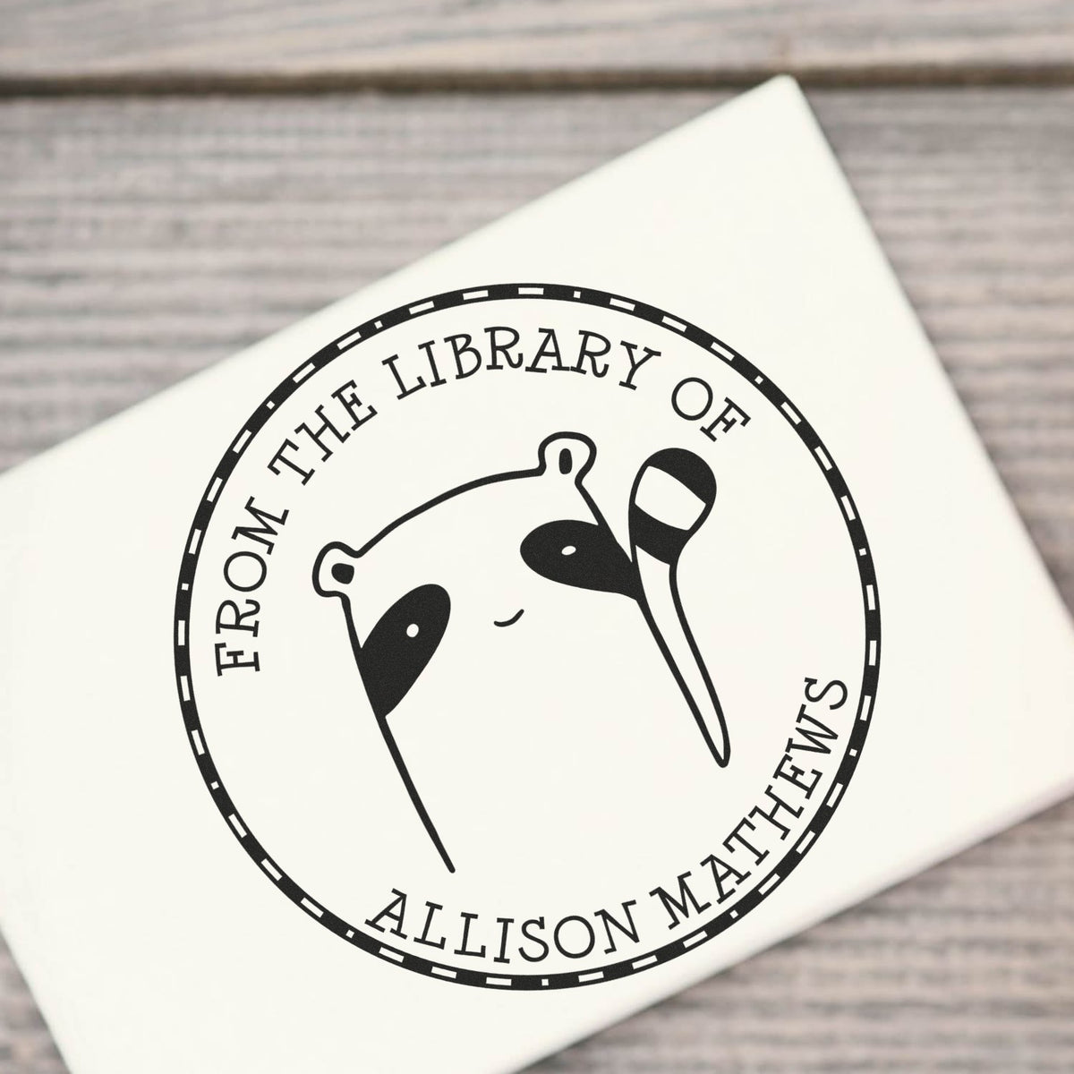 Slim Pre-Inked FreckleFlop Cartoon Animal Custom stamp from the private collection of Stamp, featuring a cute animal design. The customized mailing stamper is shown on a white surface, with text "From the Library of Allison Matthews."