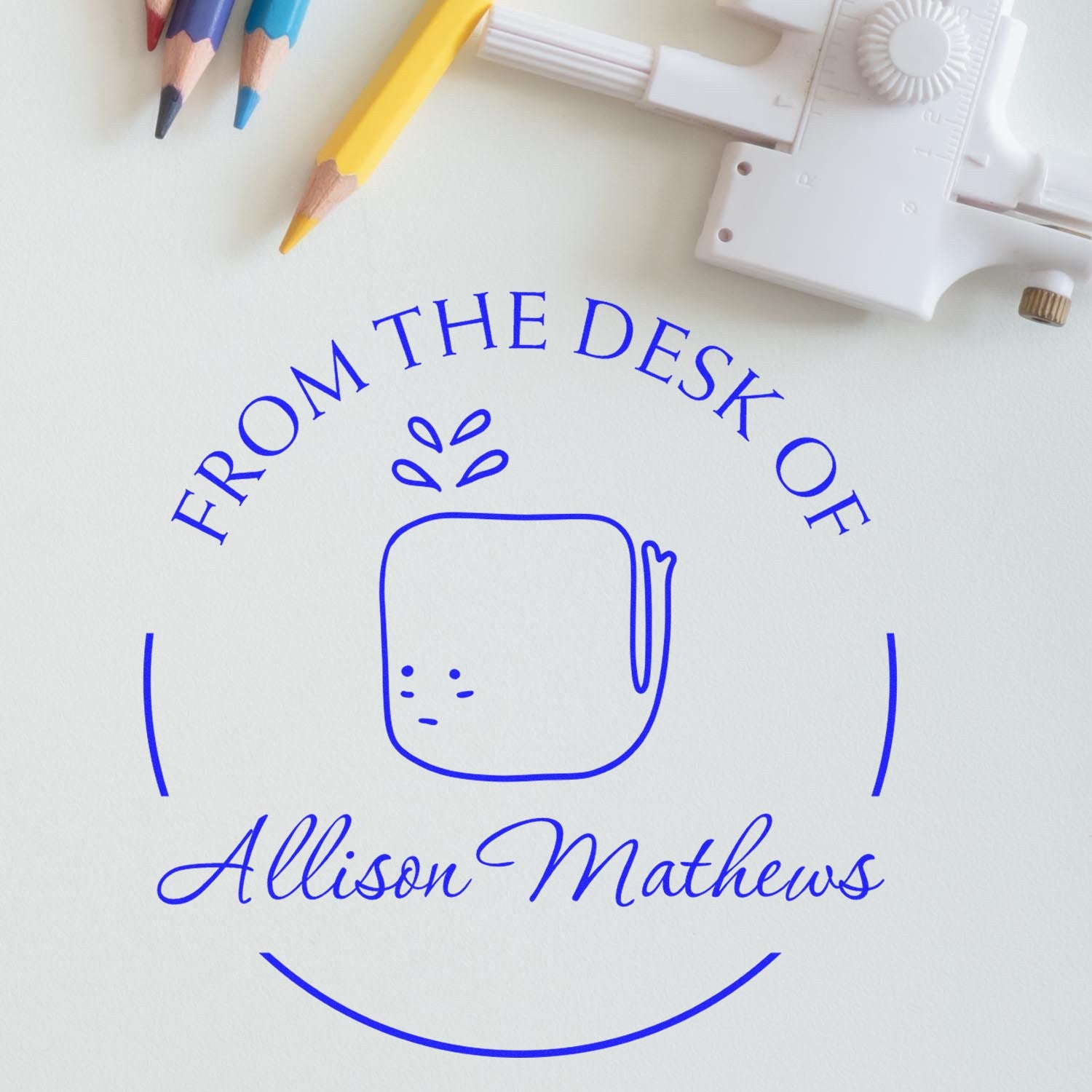 Slim Pre-Inked WhiffleWhirl Cartoon Animal Custom Book Lover Gift Stamp displayed on paper with "From the Desk of Allison Mathews" text. Custom New Address Stamp design, surrounded by colored pencils and a compass.